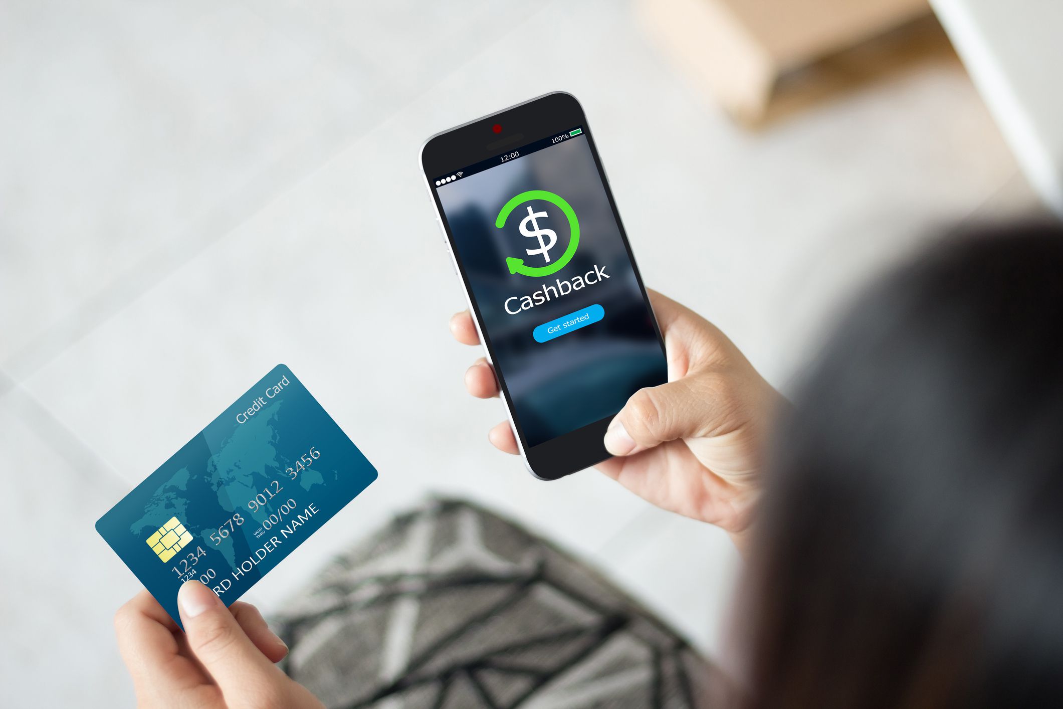 Female hands using mobile phone and holding credit card
