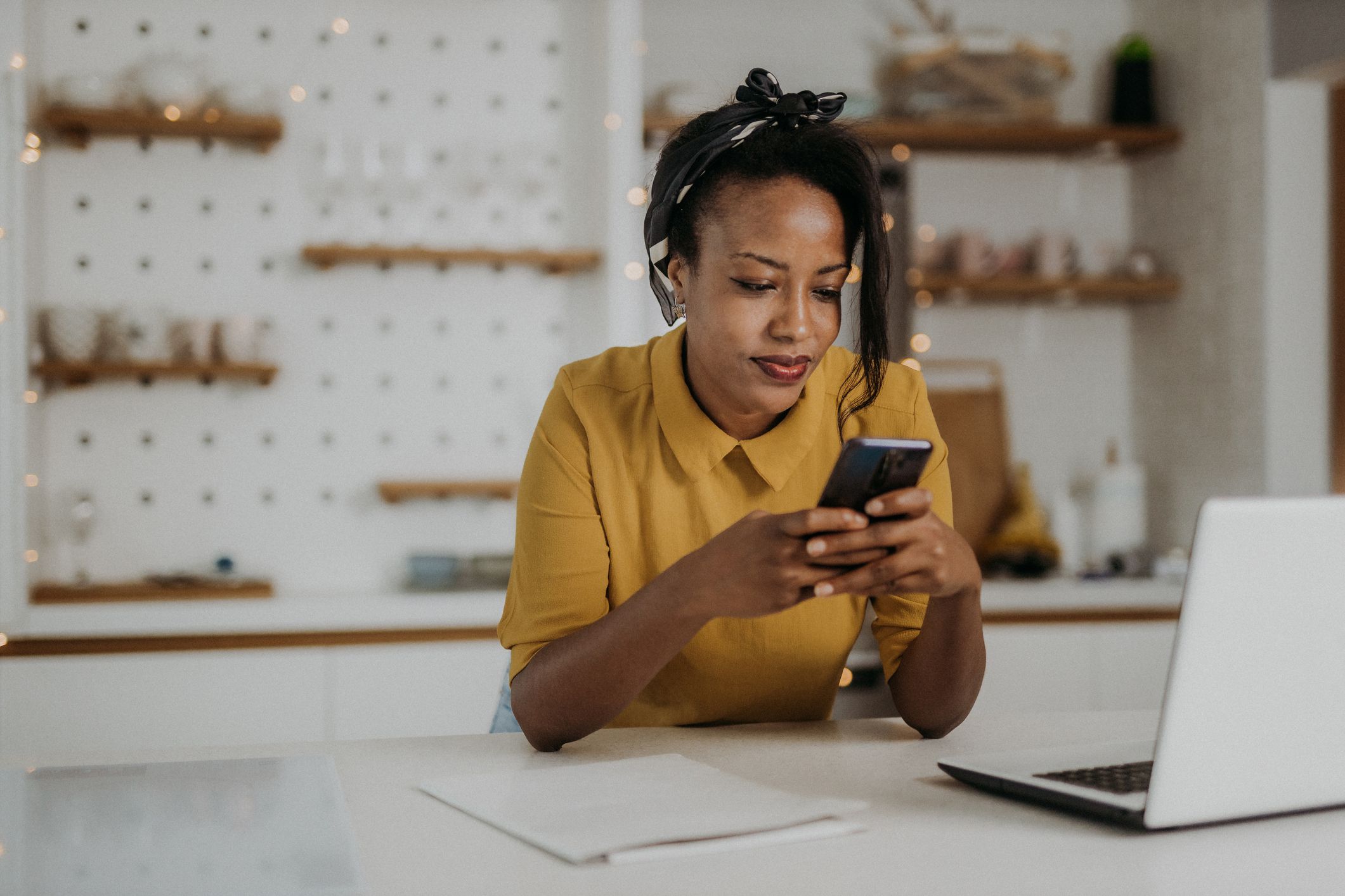 Young woman using her smartphone at home