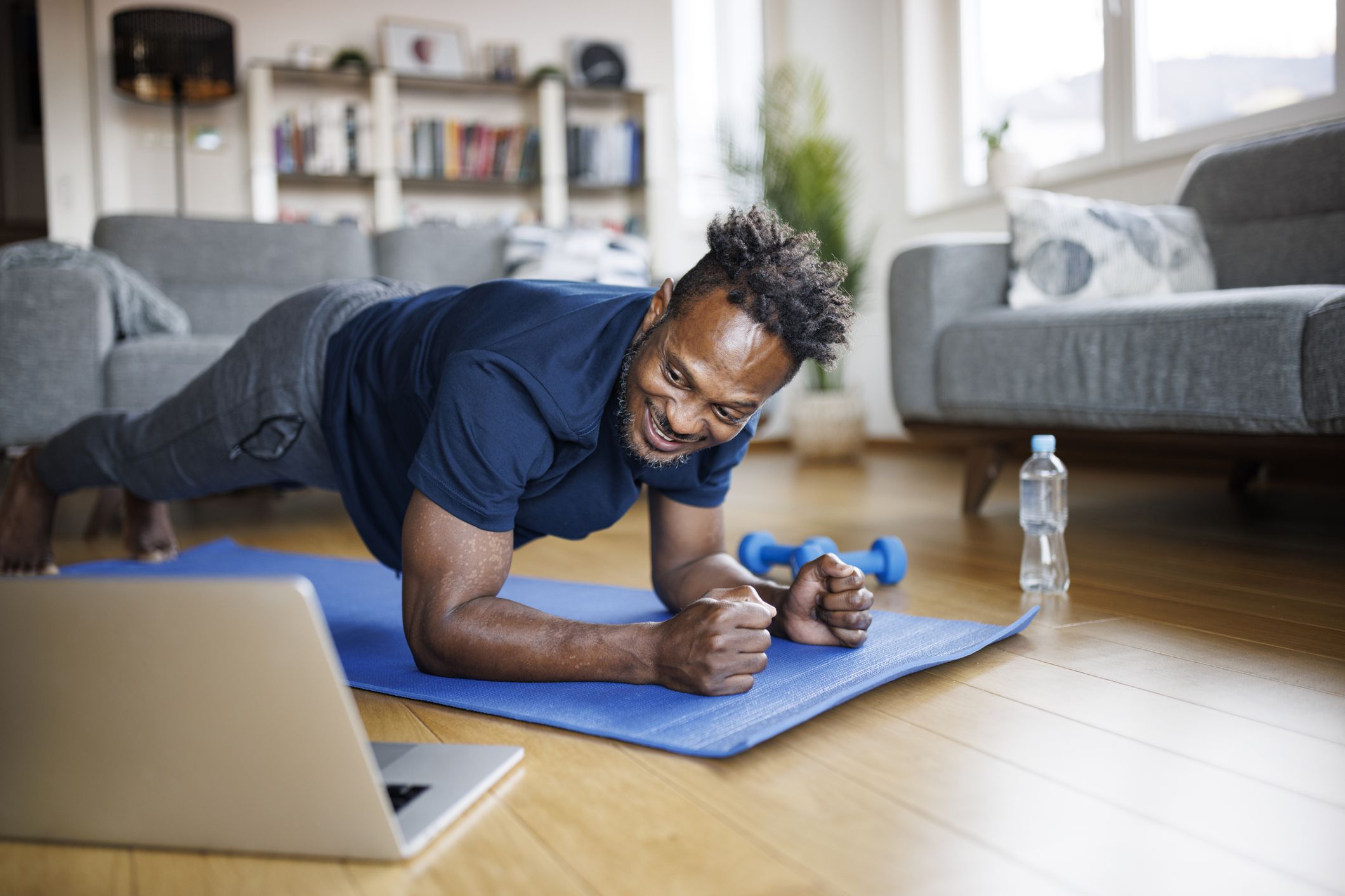 Smiling man working out at home