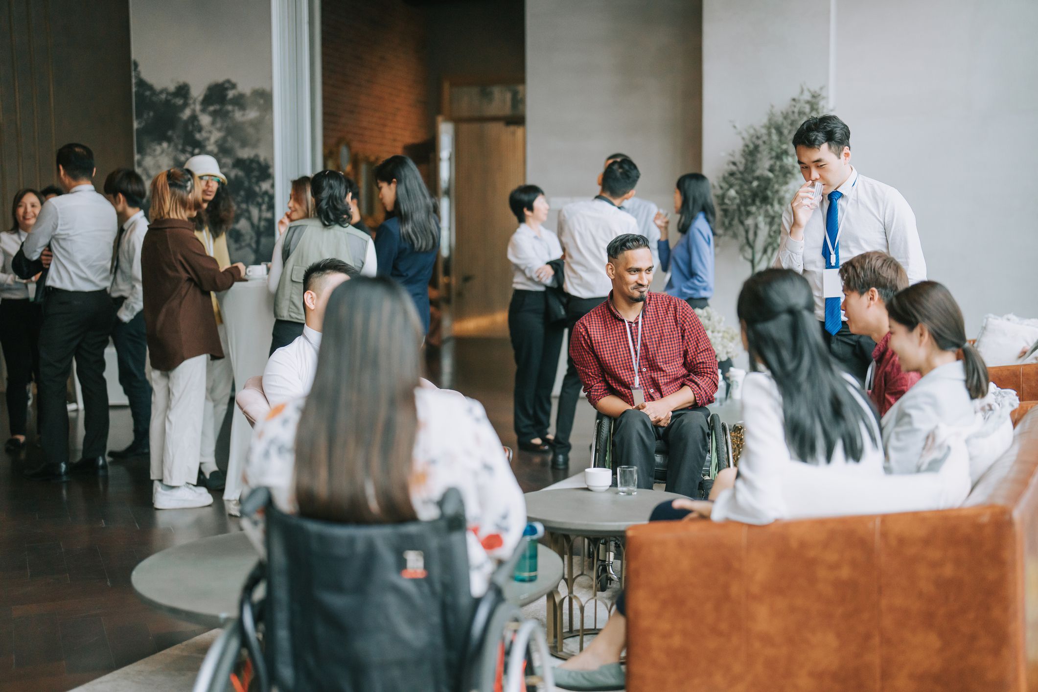 Diversify Asian seminar participants casual chat after successful conference event at lounge stock photo
