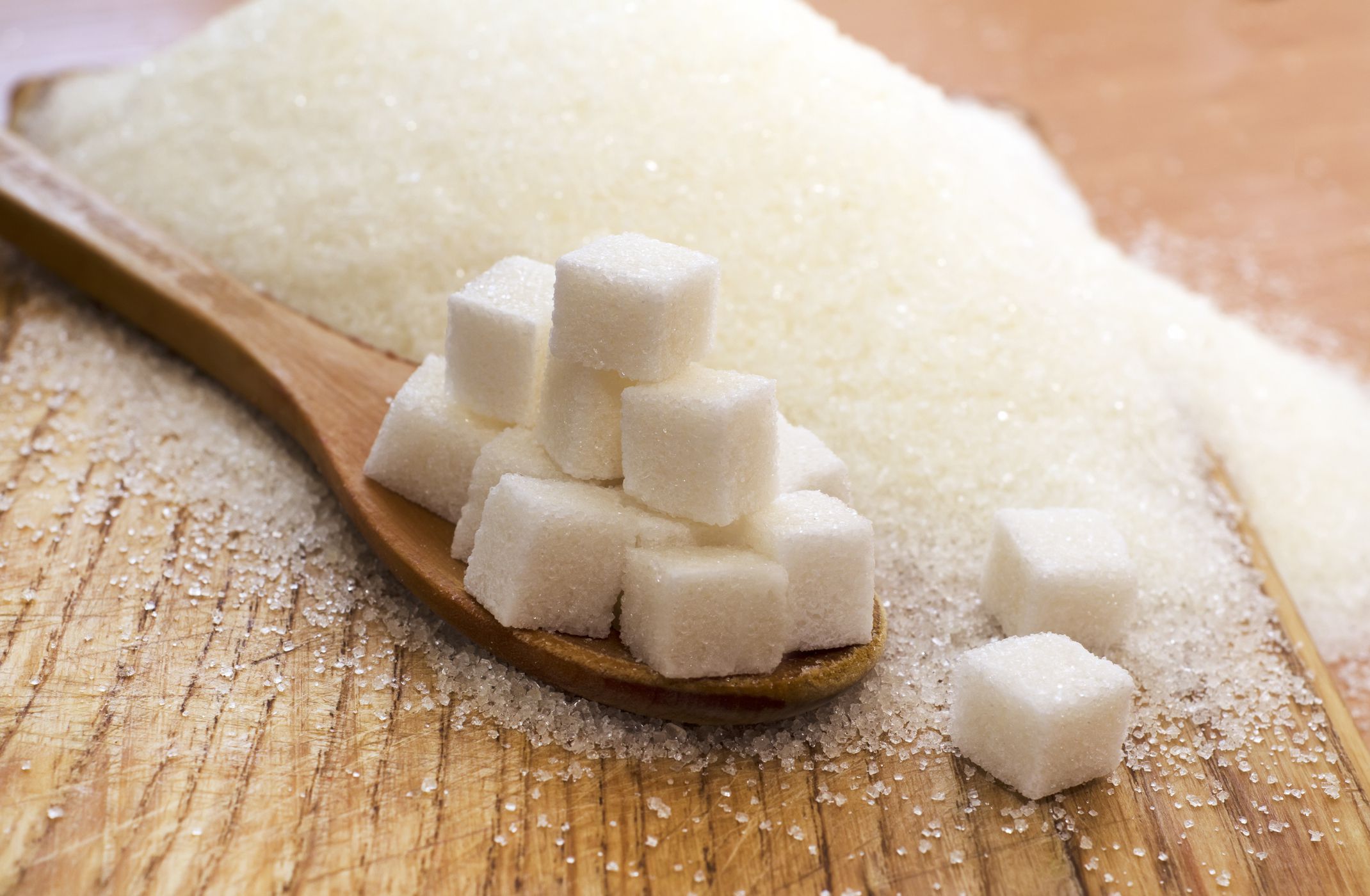 sugar in a wooden spoon