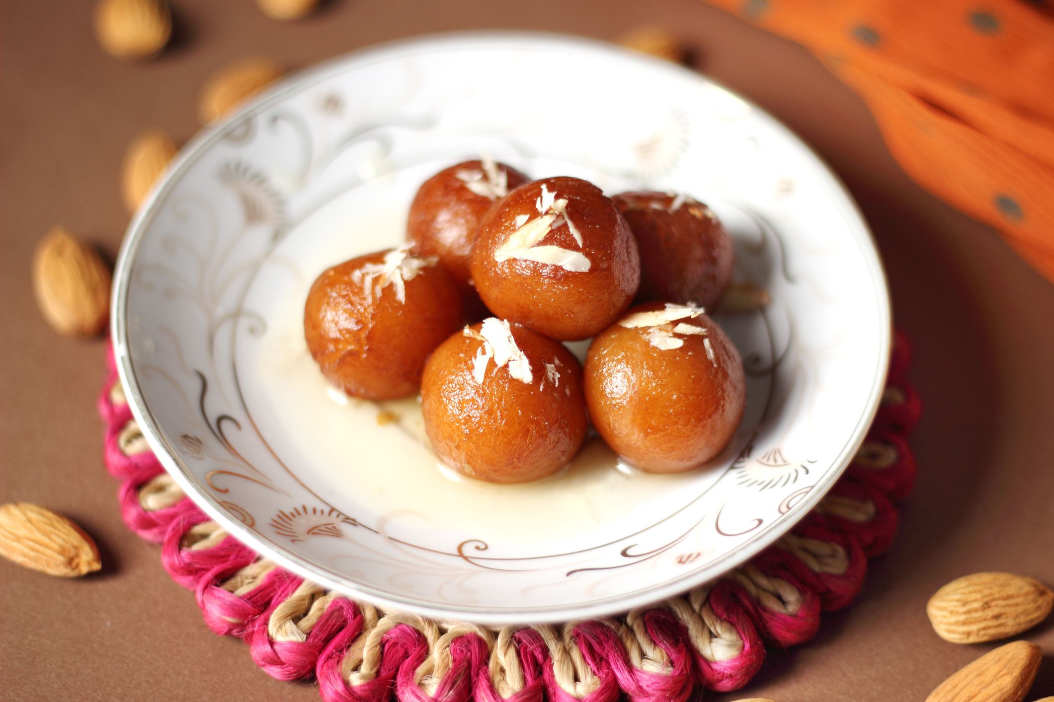 Gulab jamun is very popular Indian dessert made with fresh homemade Khoya, soaked in warm sugar surup.