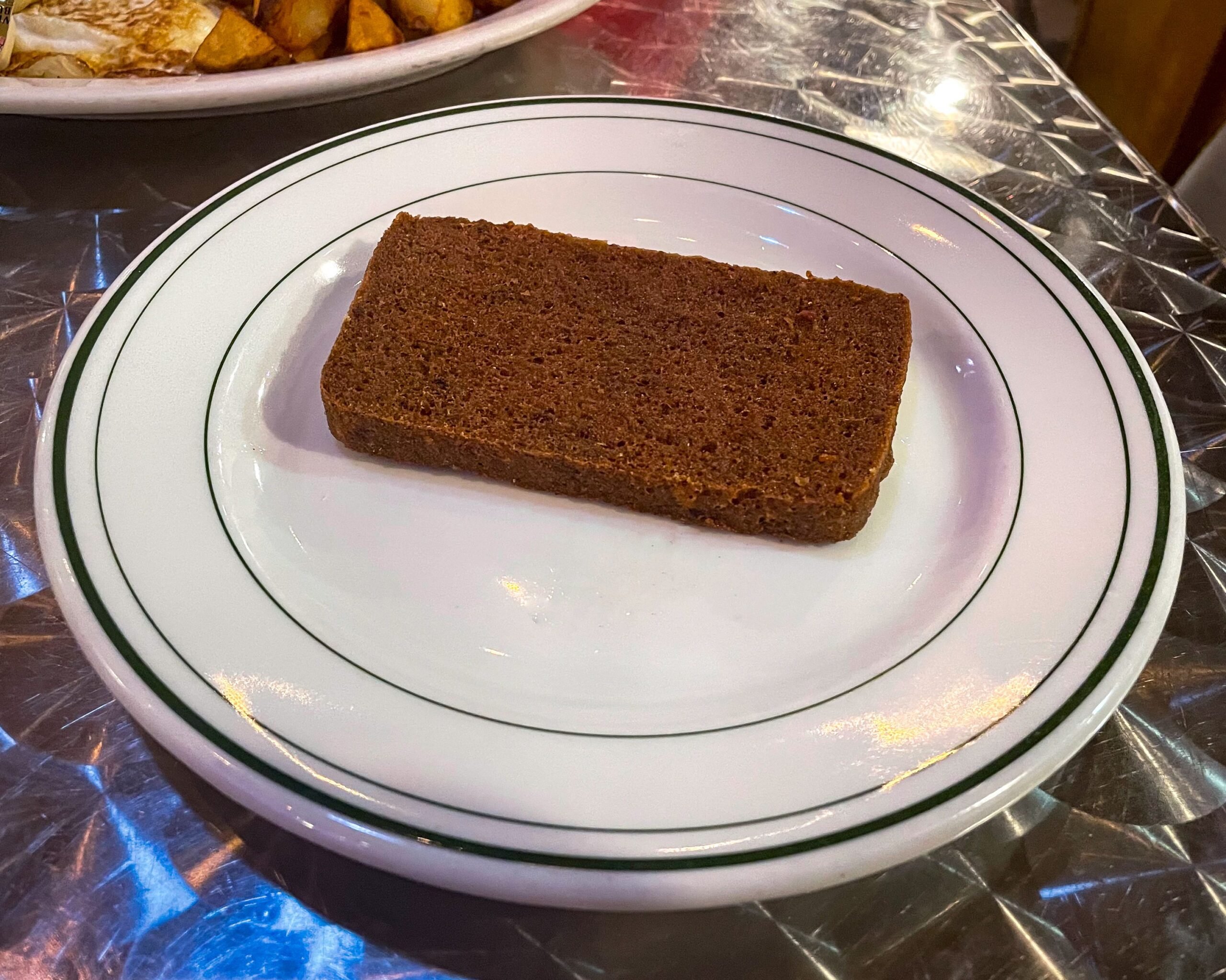 Philadelphia, PA US Oct 14, 2023 Plate of Scrapple an ethnic food of the Pennsylvania Dutch. A mush of pork scraps and trimmings combined with cornmeal and wheat flour.