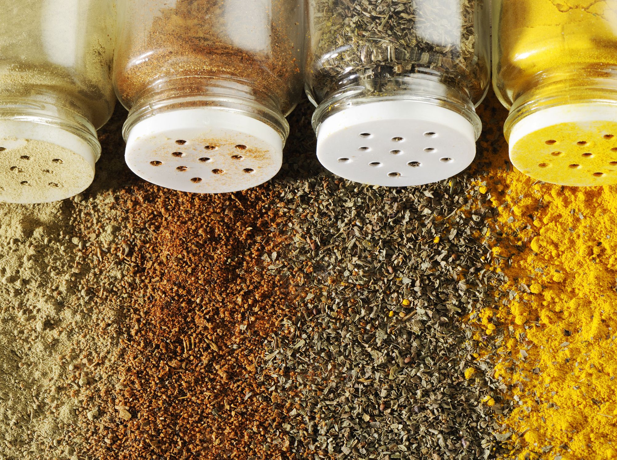 Bottle of spices with spices background