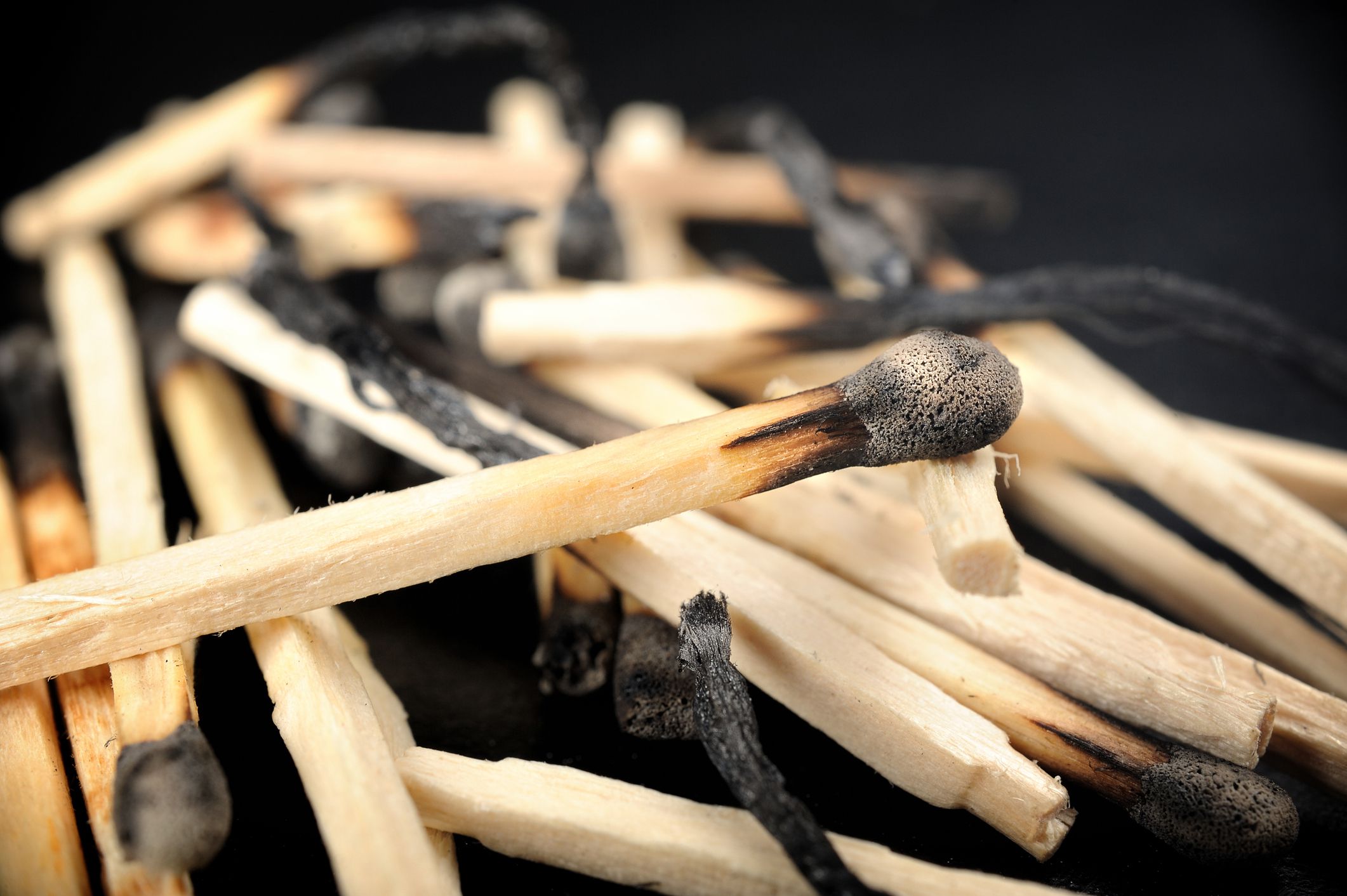 closeup heap of burned wooden matches