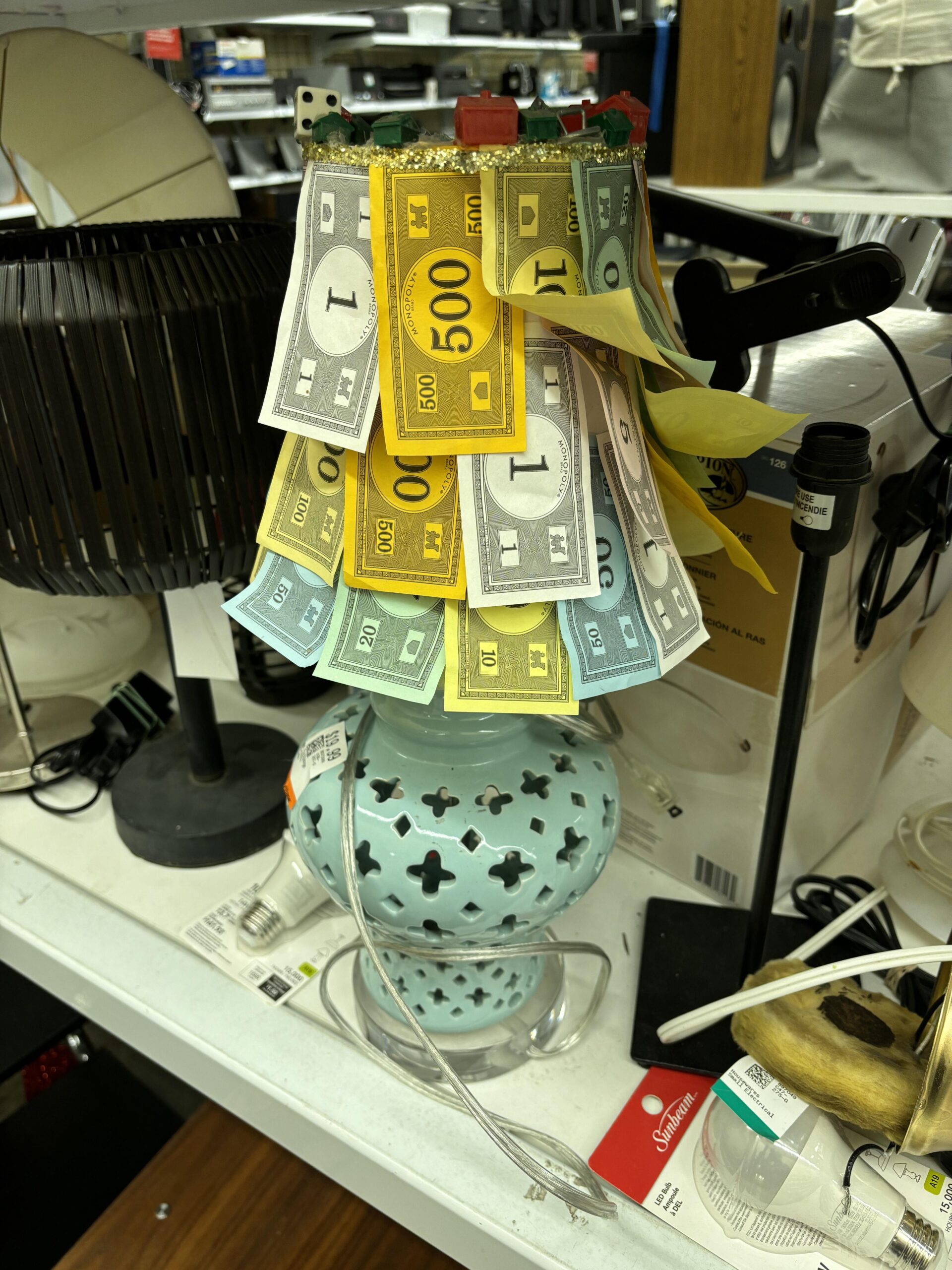 Lamp with a shade made of monopoly money