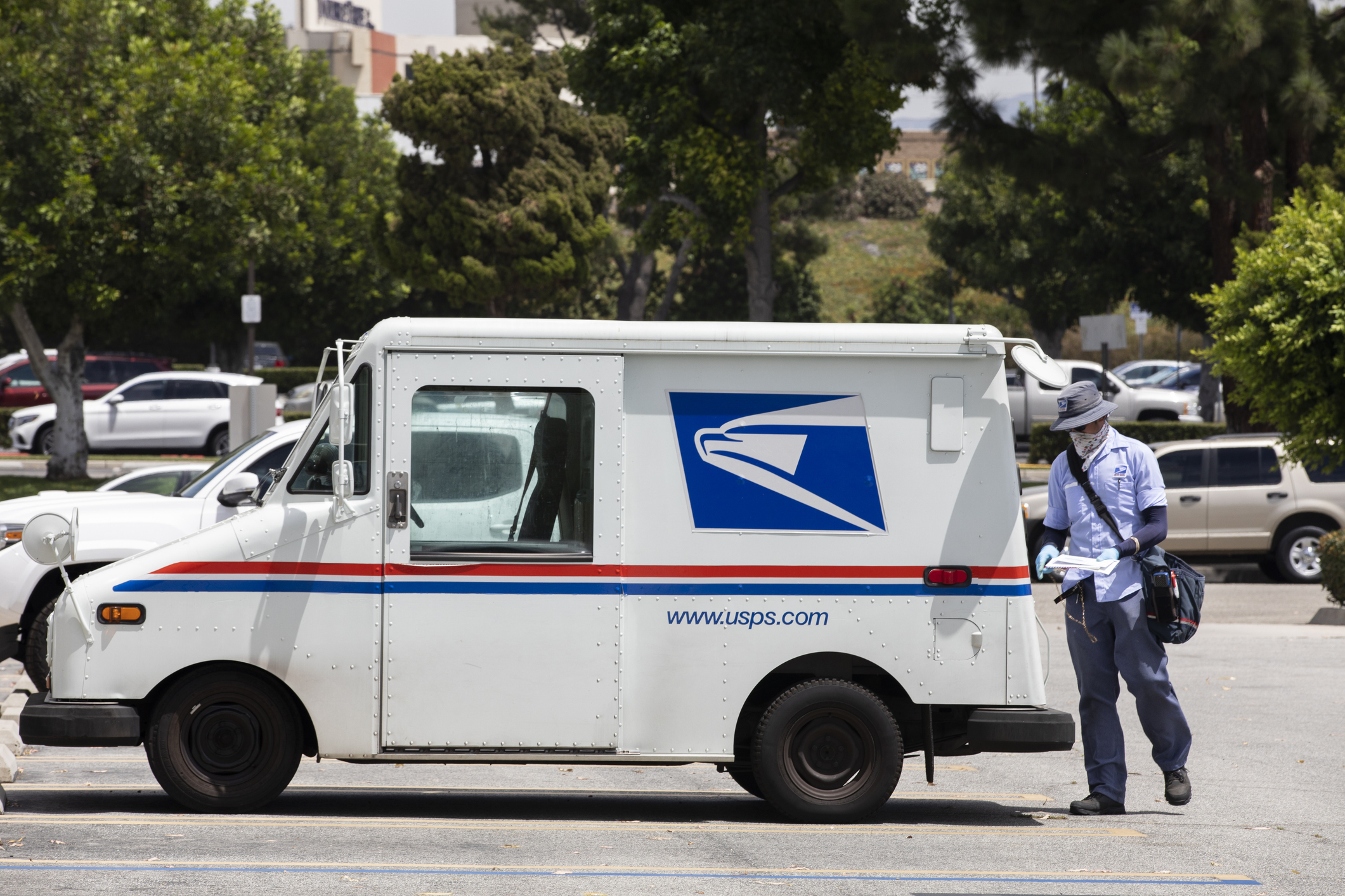 USPS Mail Truck and Postal Carrier Making a Deliveries, Fullerton, California