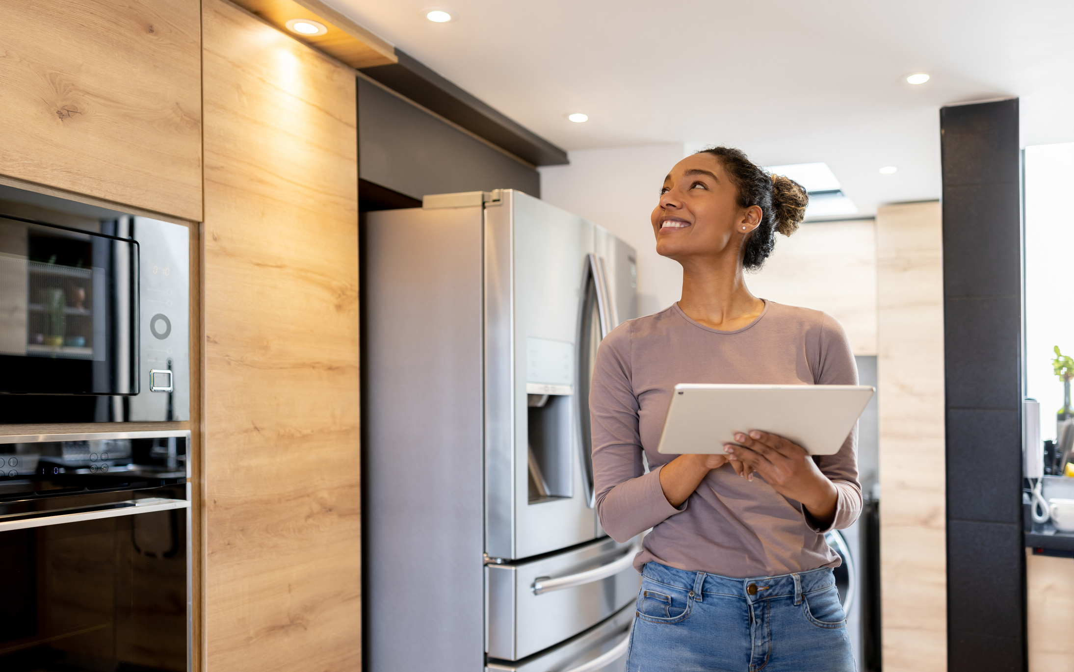 Woman Turning on Lights With a Tablet, Smart Home