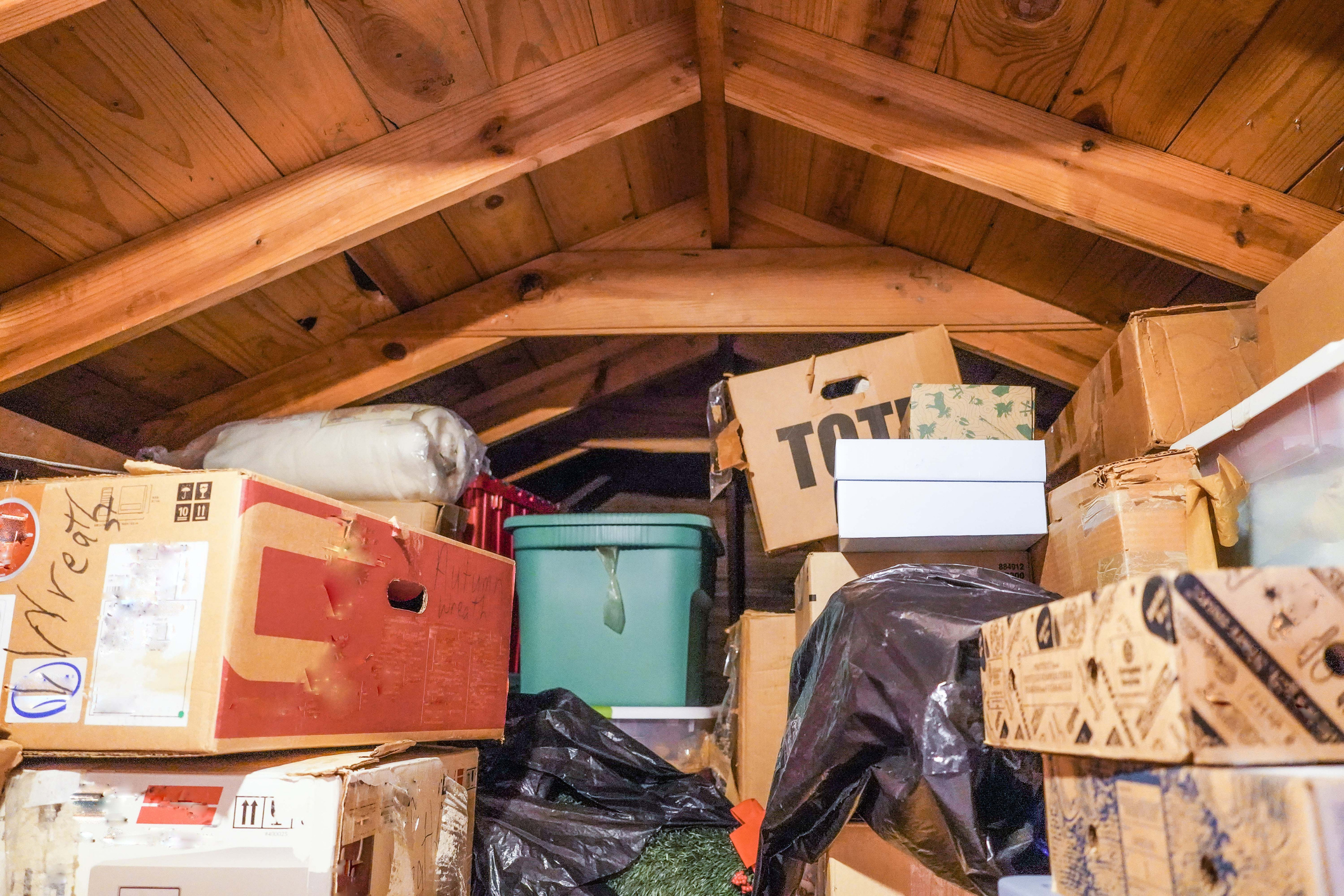 Stacked Boxes and Storage Units in an Attic