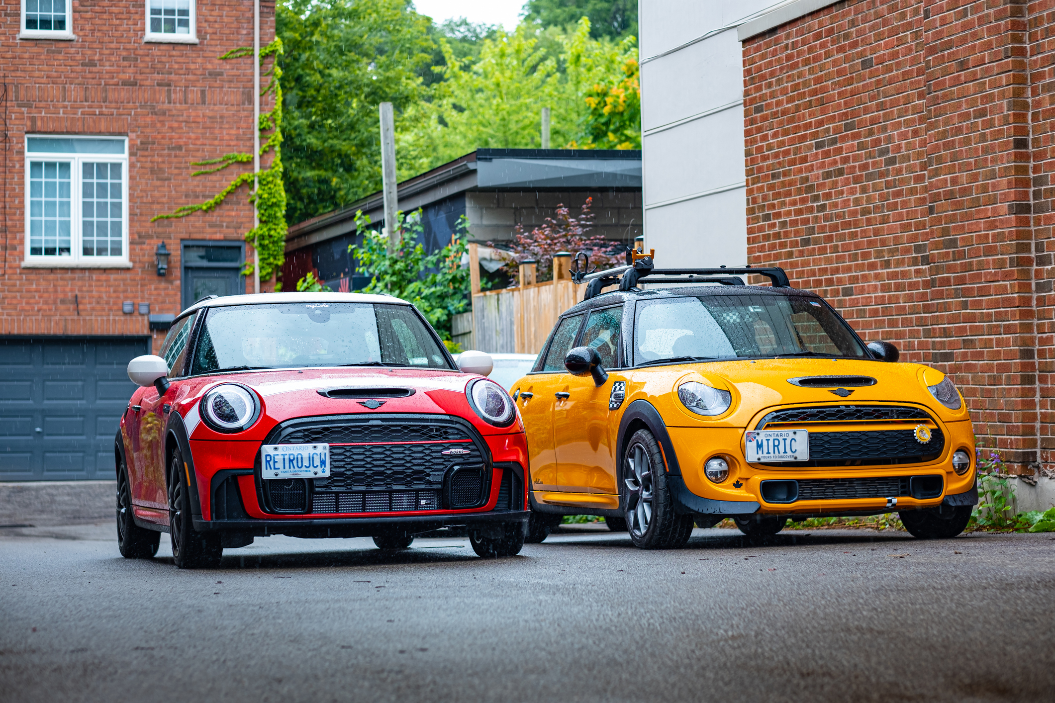 Two Mini Cooper Cars Parked Side by Side on an Urban Street