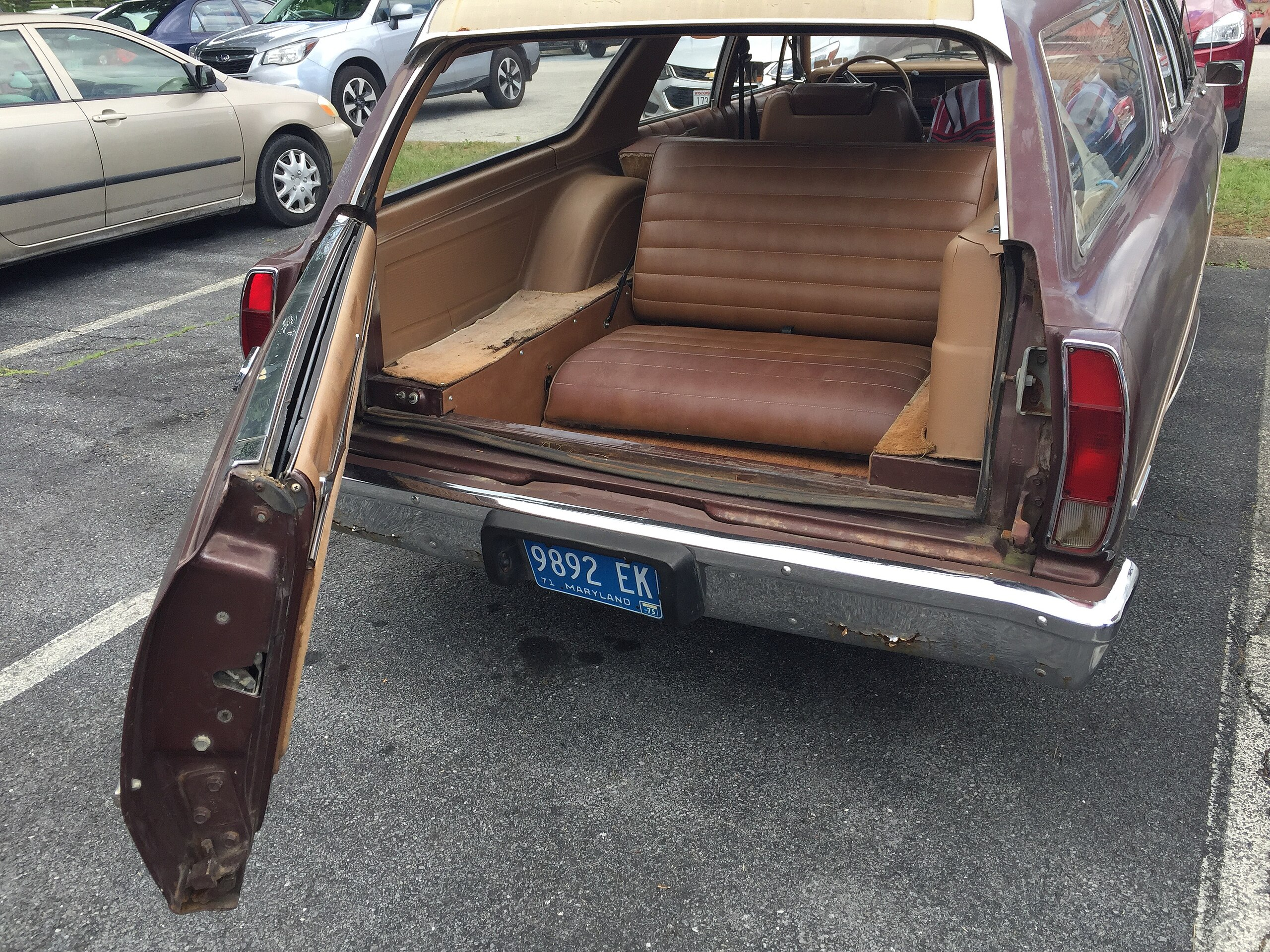 1975 AMC Matador With Third-Row Seat Door Opened for Passengers