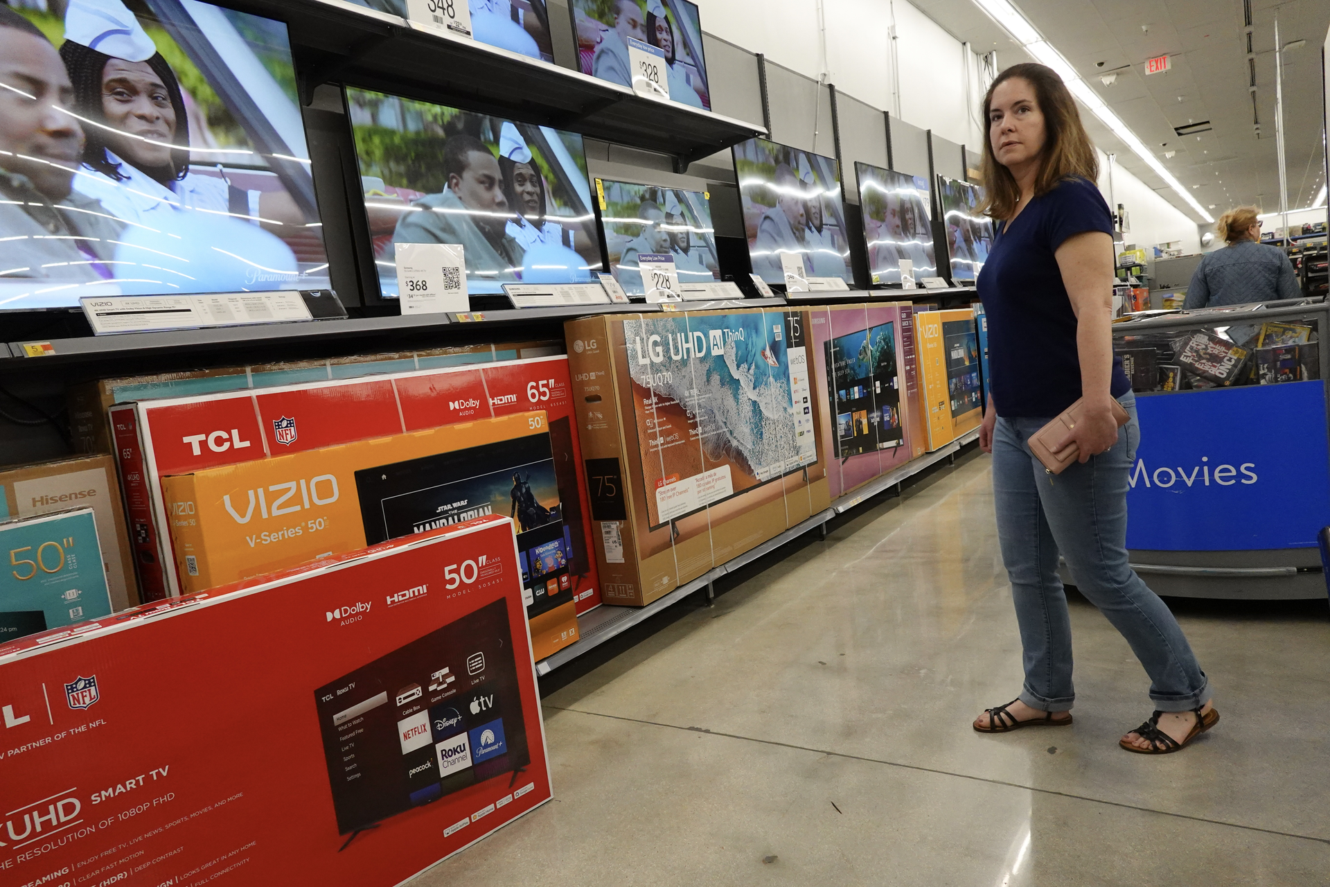 A Customer Approaches TV Section at a Walmart, Hallandale Beach, Florida