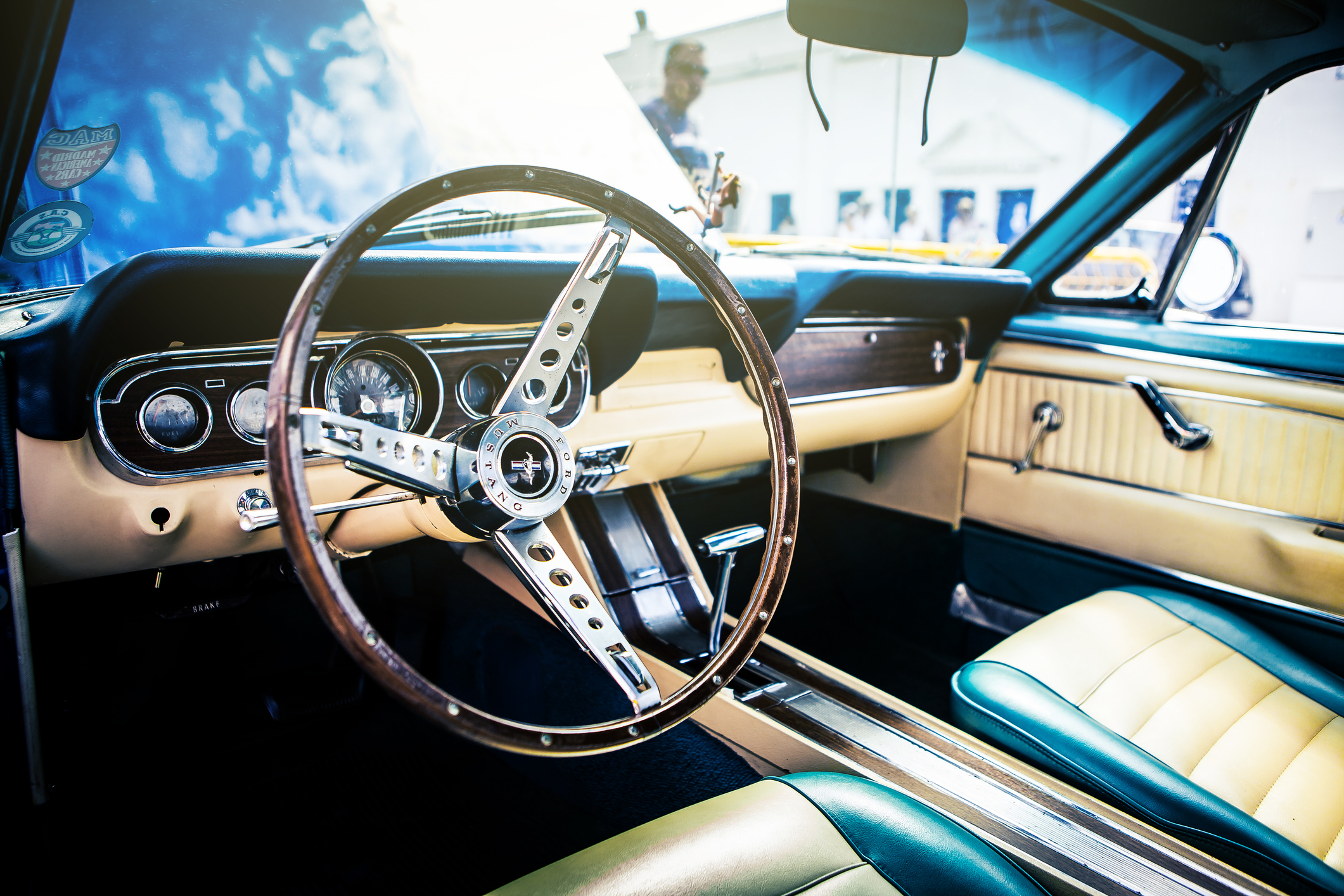 Steering Wheel and Dashboard Interior of a Vintage Ford Mustang in a Car Show