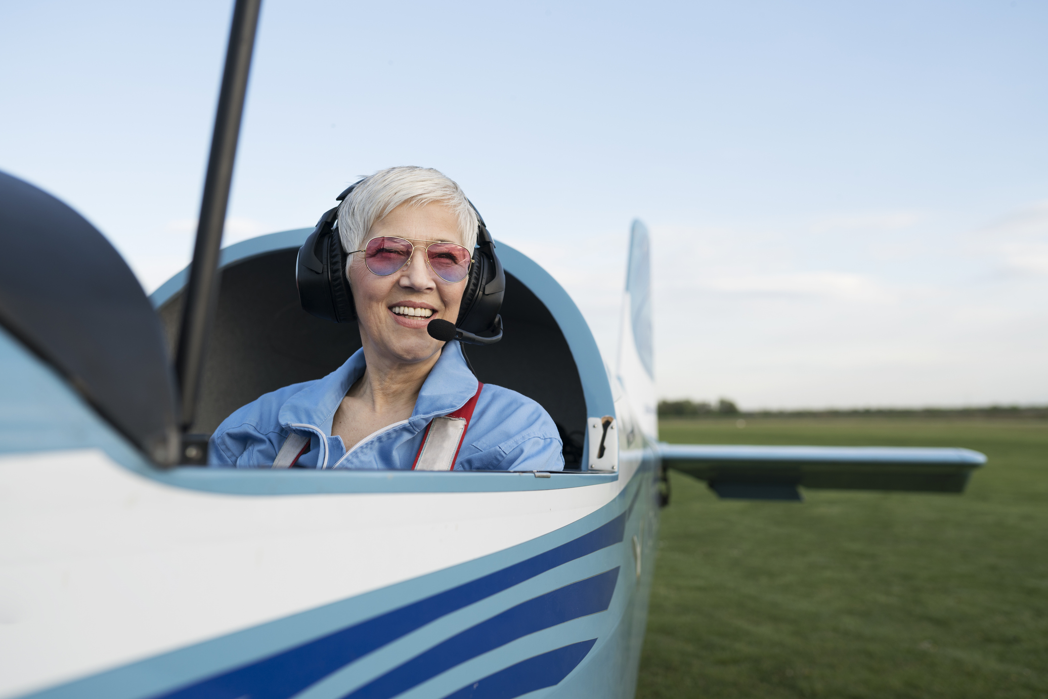 Smiling Senior Woman While Sitting in an Open Glider