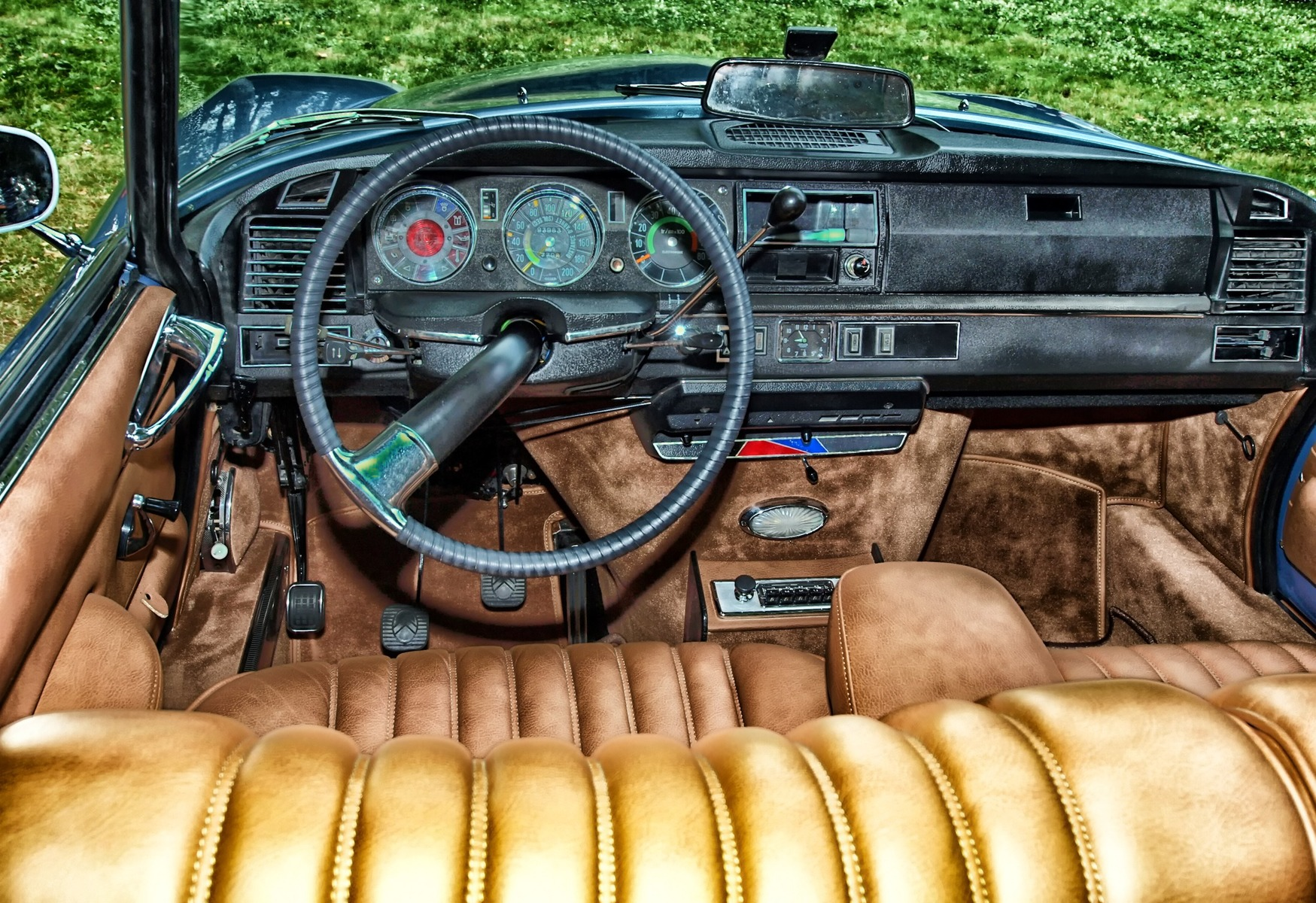Brownish Tan Suede Interior of a Vintage Convertible Car, in the Grass