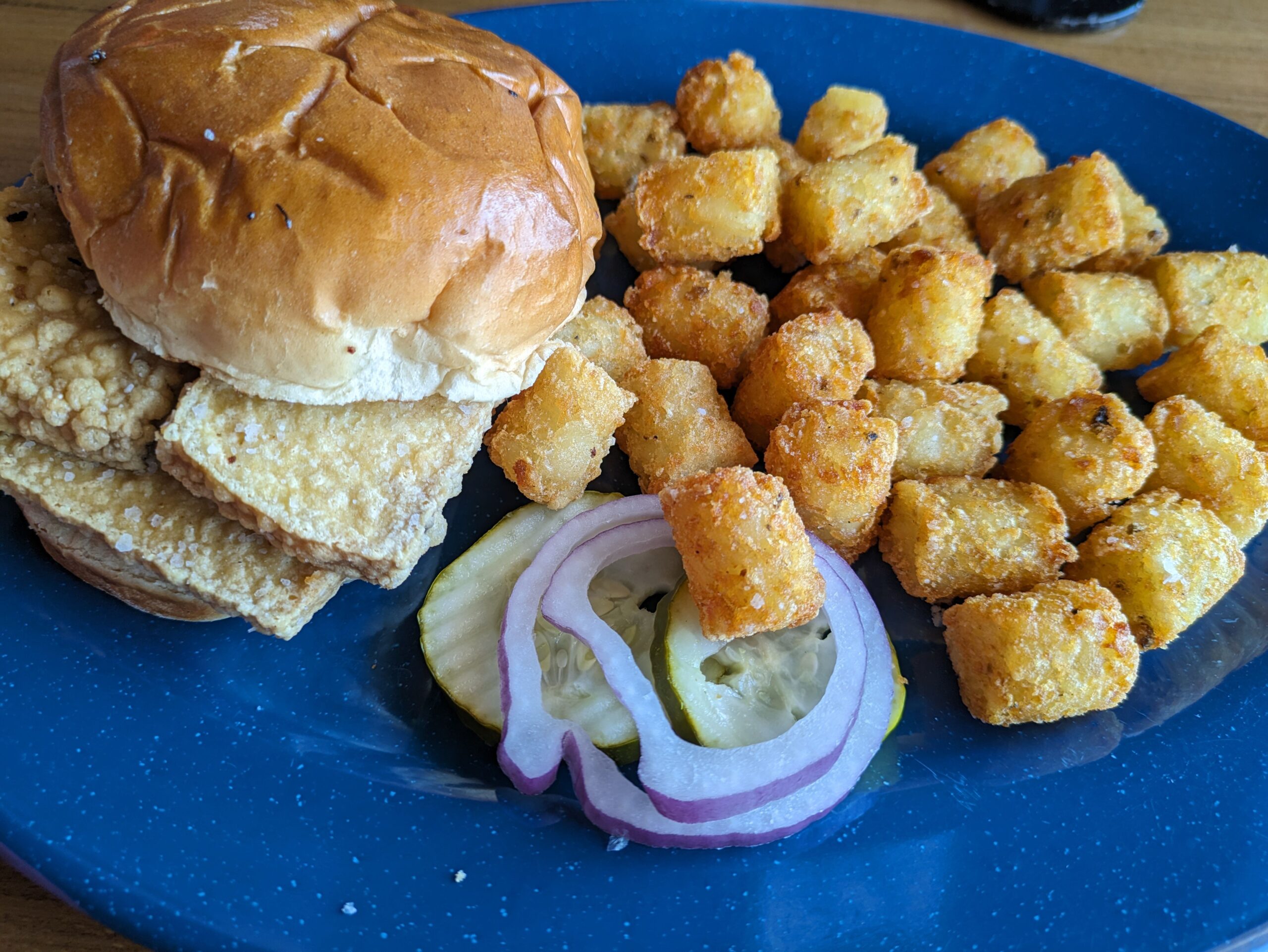 Crispy tofu sandwich with tater tots