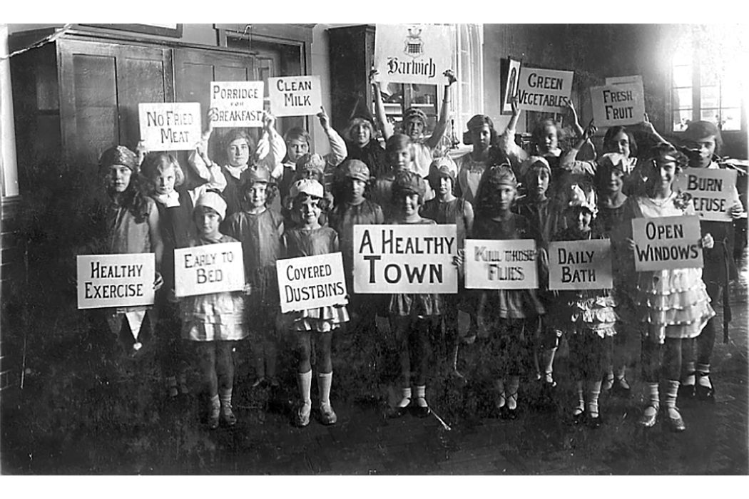 School children holding up signs in the 1940s