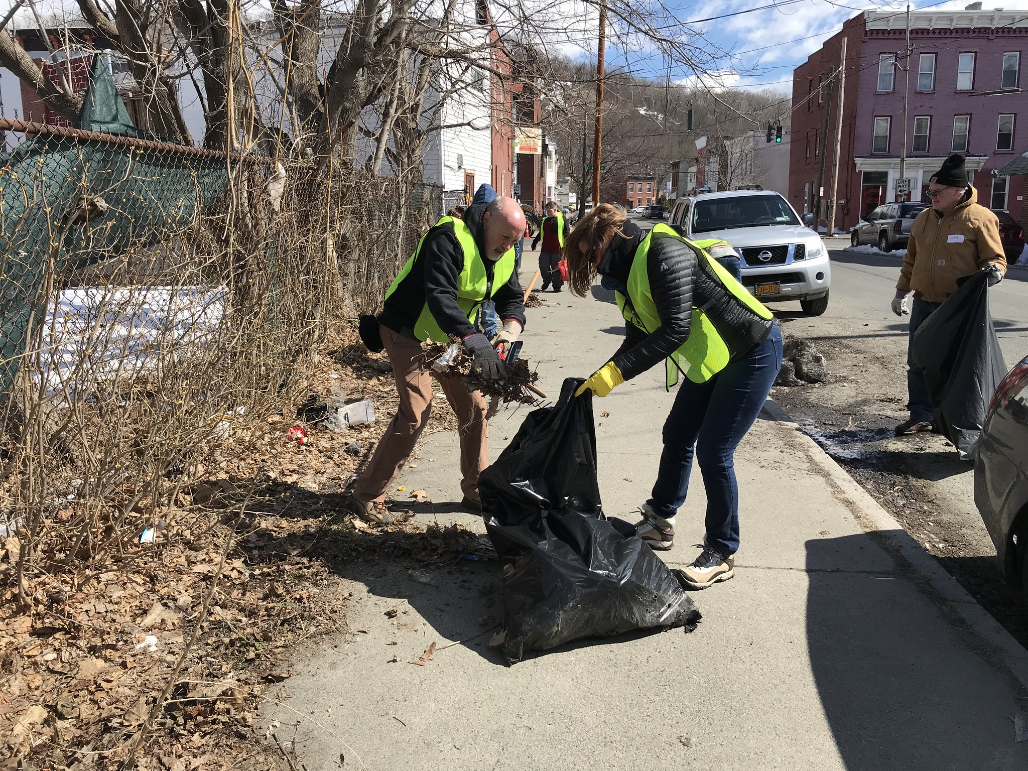 Two Seniors Putting Trash in a Bag, During a Neighborhood Cleanup, South Troy, New York