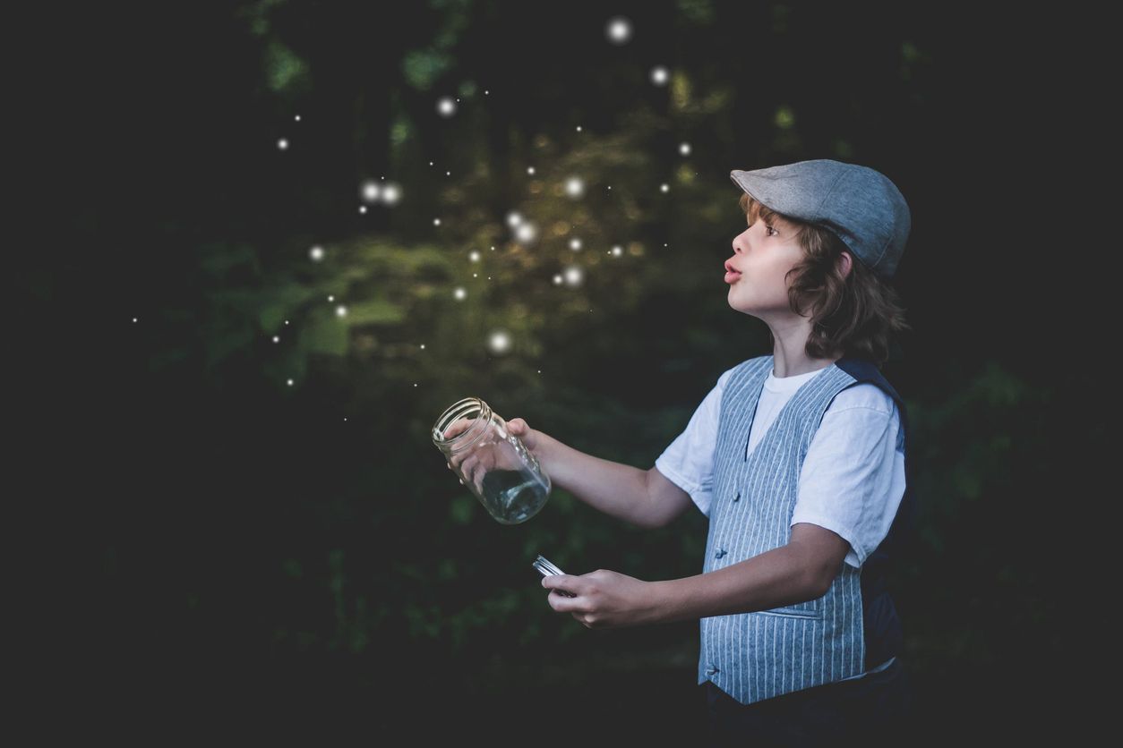 Woman holding a jar of fireflies