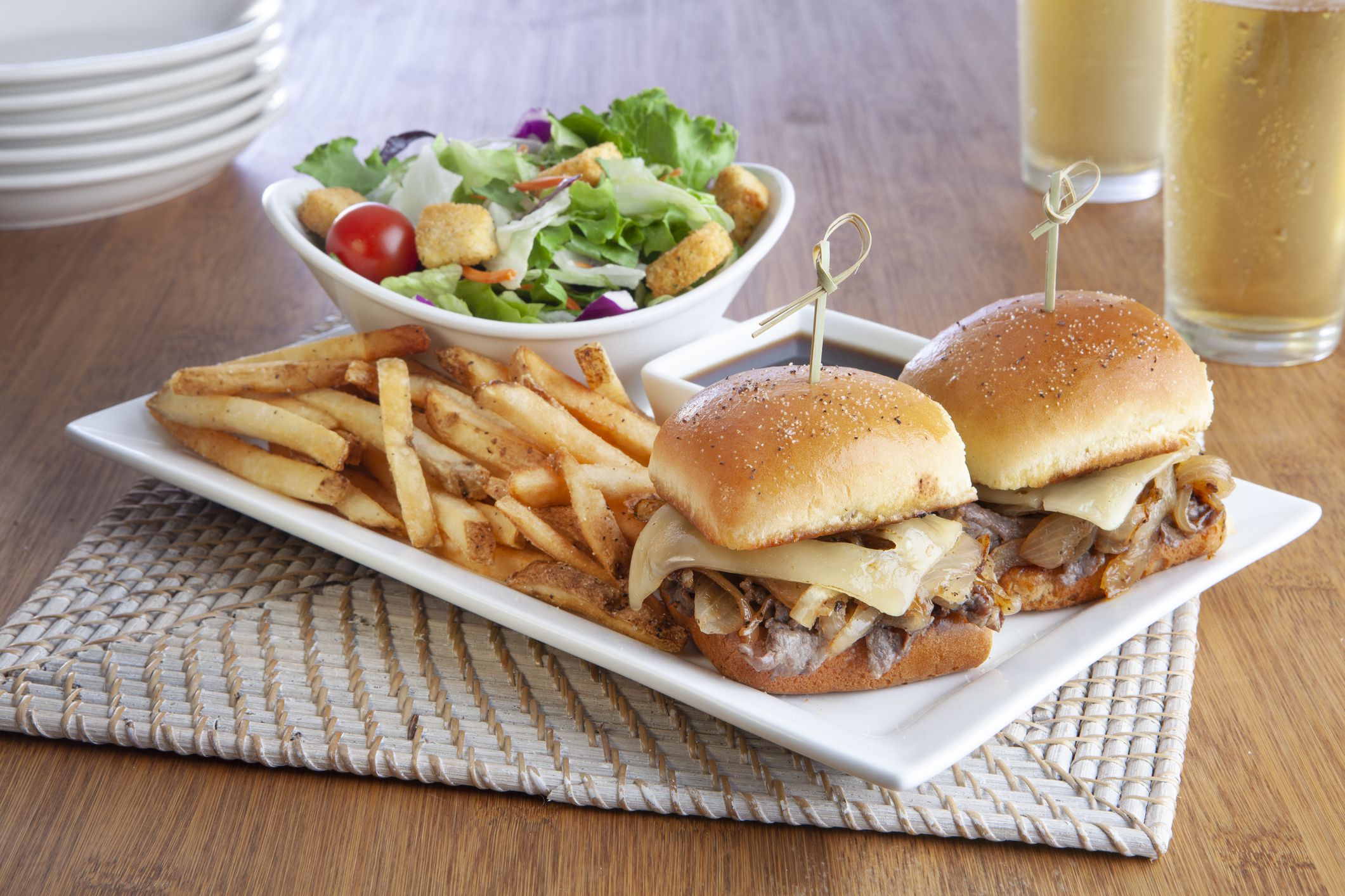 Philadelphia sliders with french fries and salad