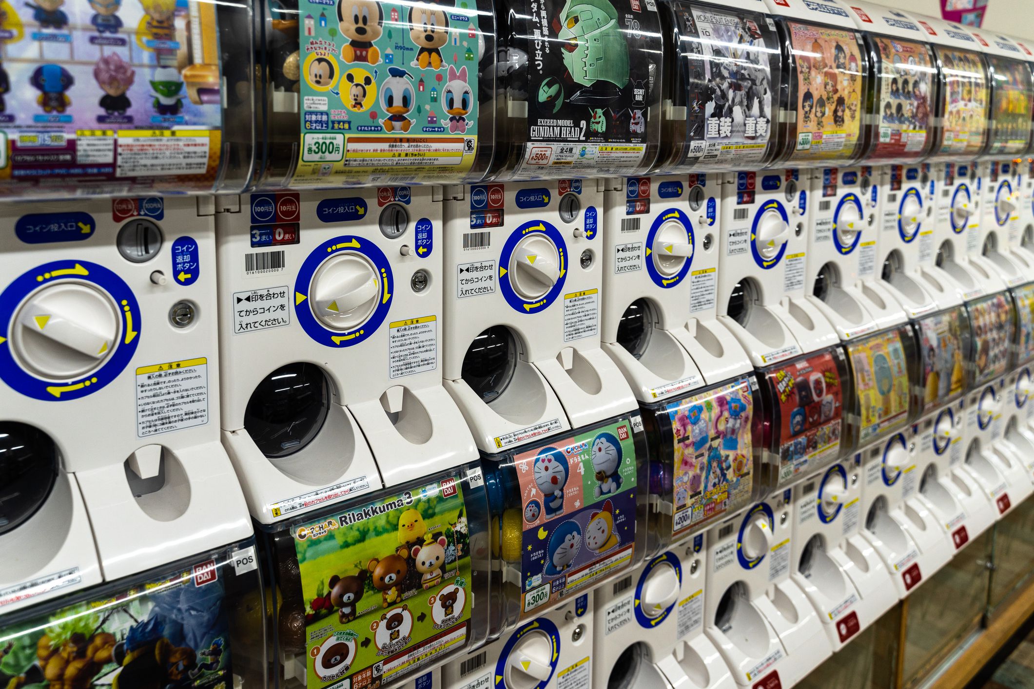 Kyoto, Japan, August 16, 2019 – Row of gashapon vending machines selling capsule toys related to cartoons and manga characters