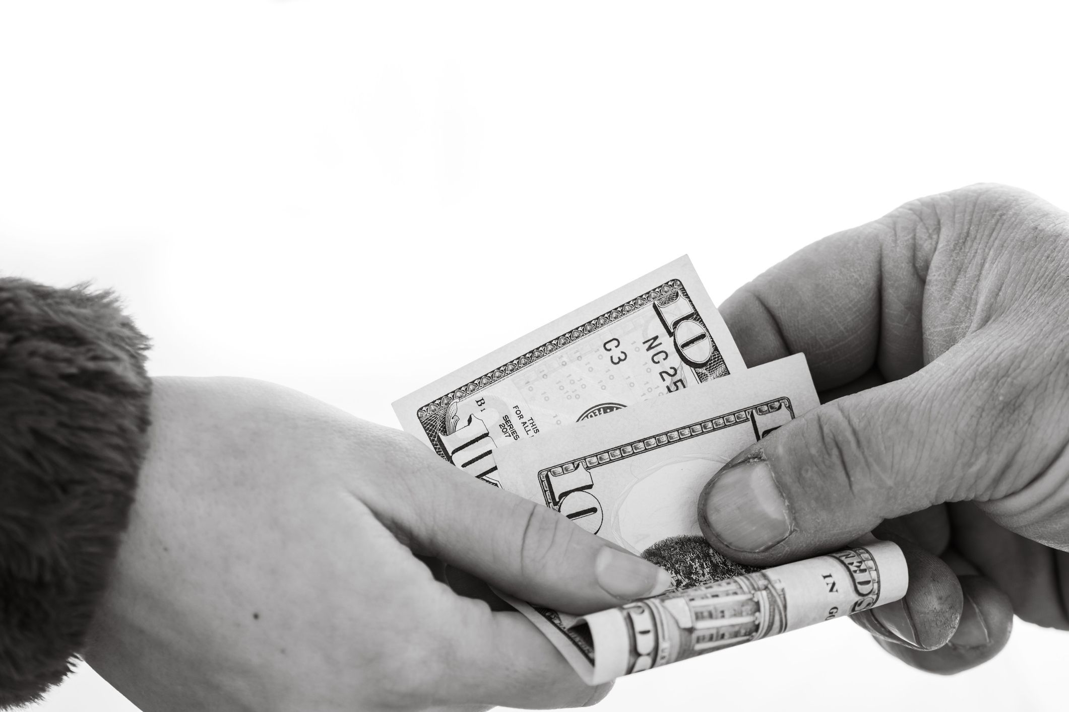 A woman giving United States dollars to a man