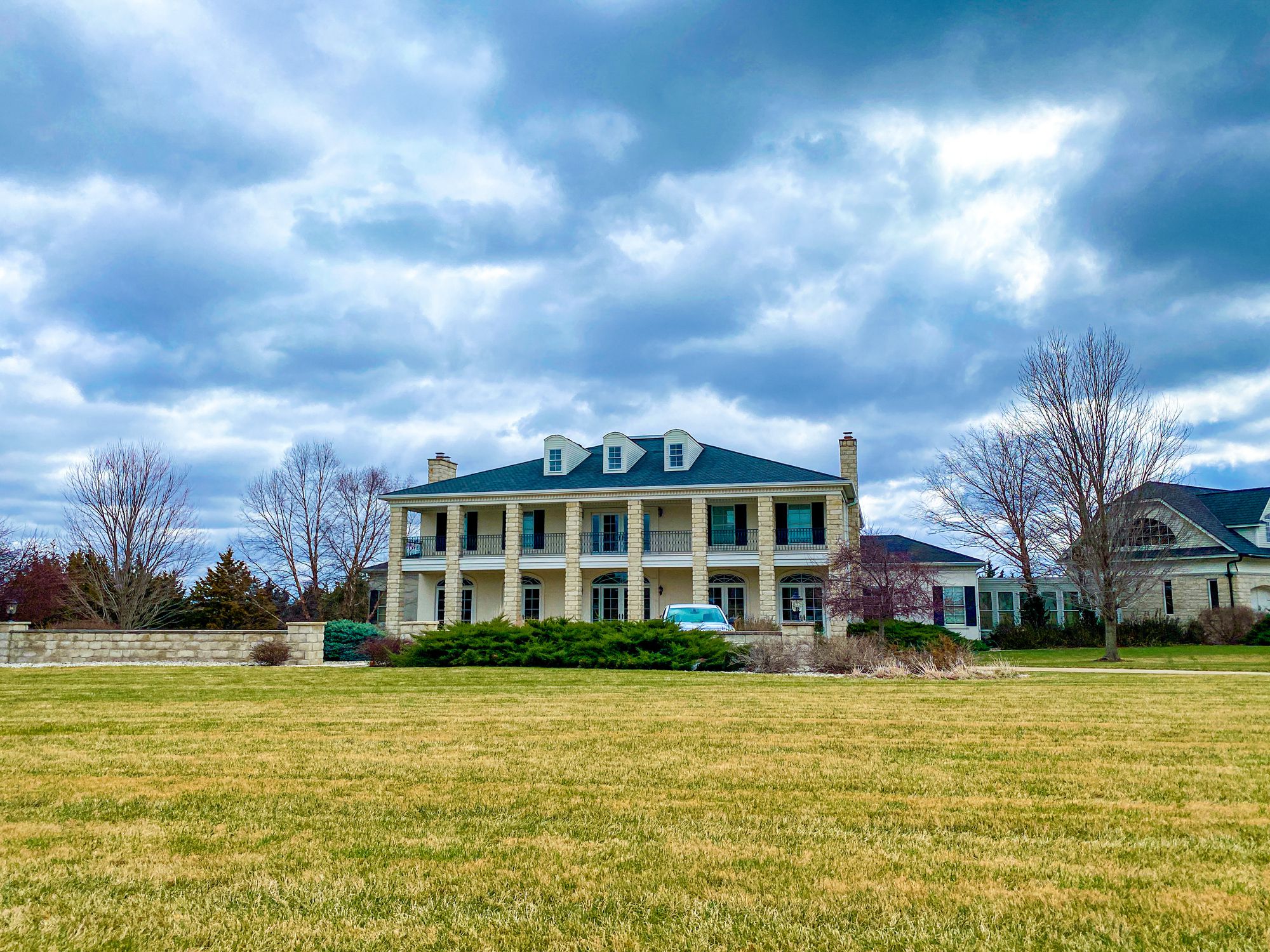 March 31, 2022 Manhattan, Kansas. A beautiful home can be seen from the street in Manhattan, Kansas.