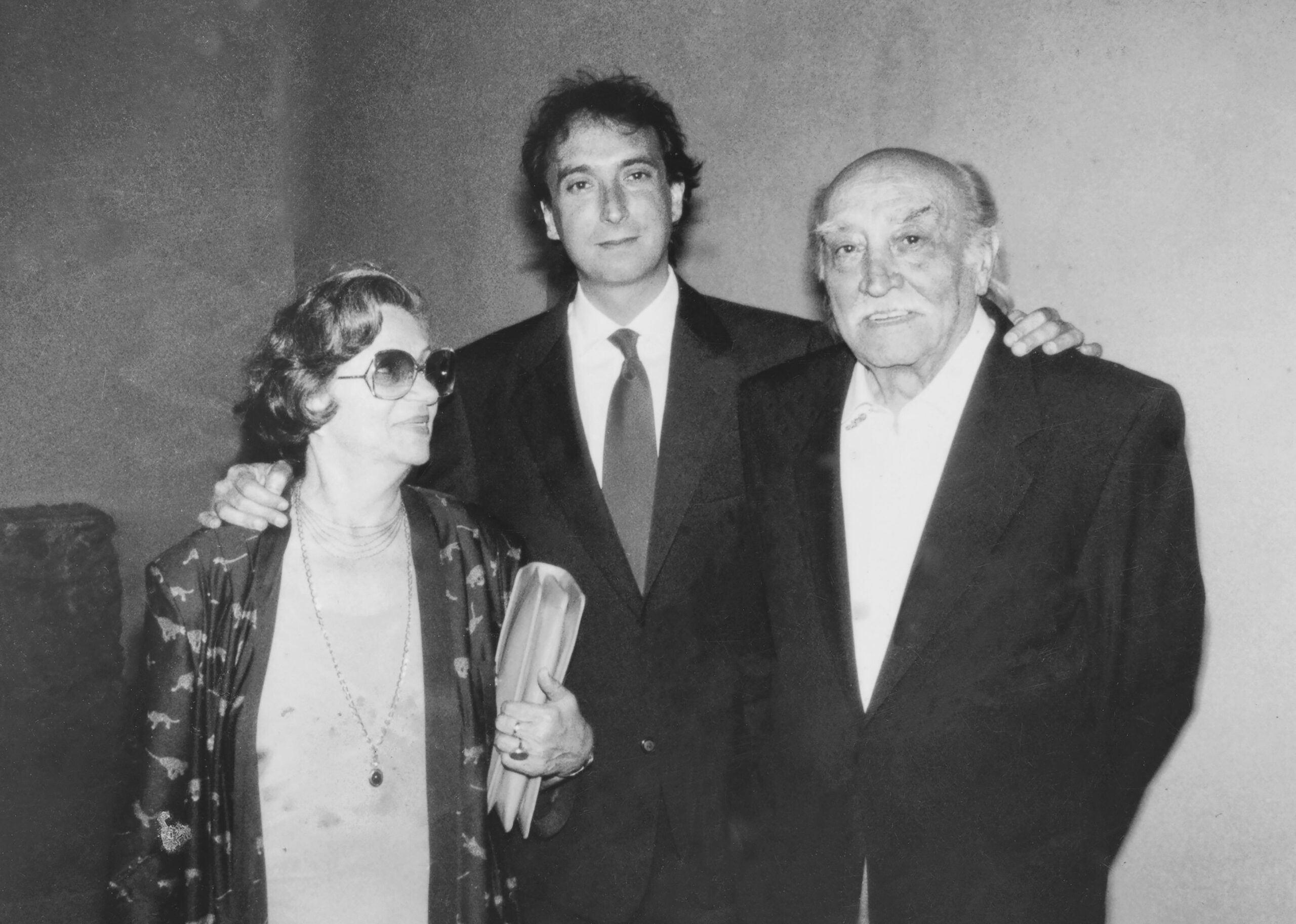Young groom with his parents after wedding ceremony in 1968.