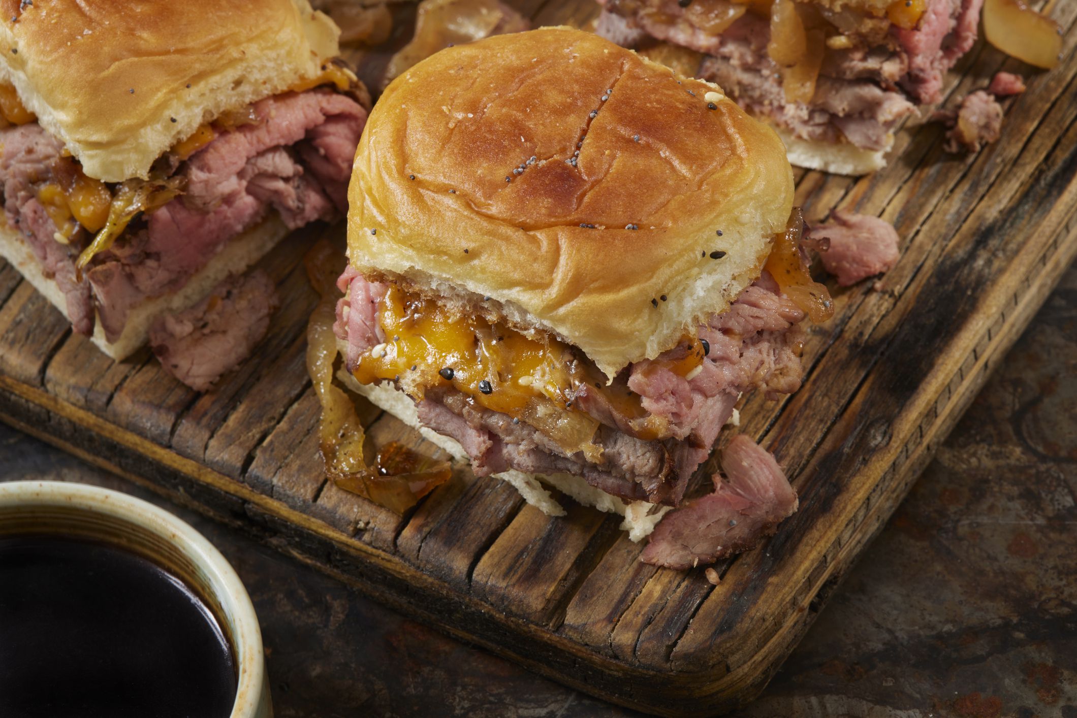 Copycat Hawaiian Roll Roast Beef and Cheddar Sliders with Fried Onions and au Jus