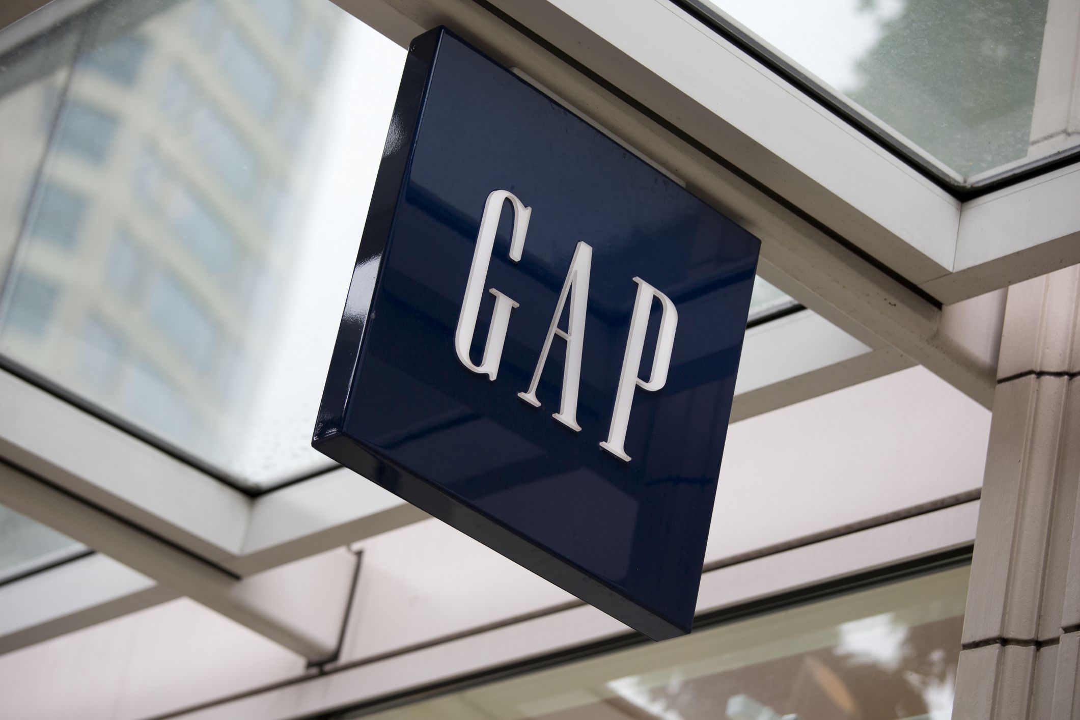 Seattle, Washington, USA - May 27, 2012: The logo and word mark of Gap, mounted above the entrance to the store in downtown Seattle.