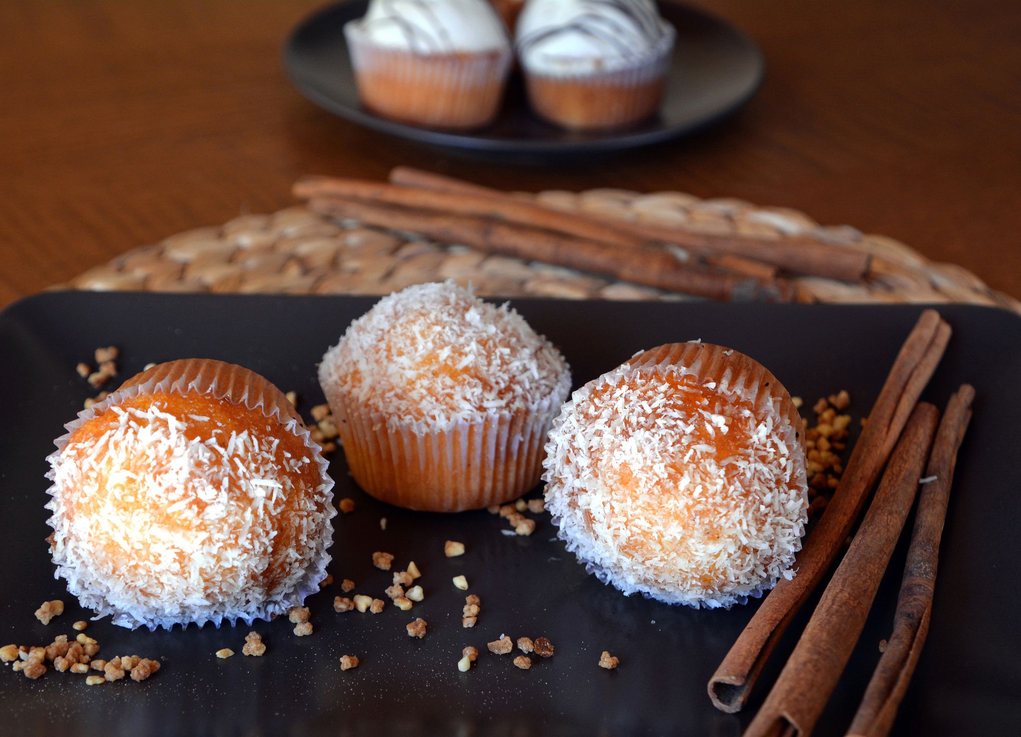 Delicious Homemade Vanilla Muffin With Chocolate And Grated Coconut On A Plate.
