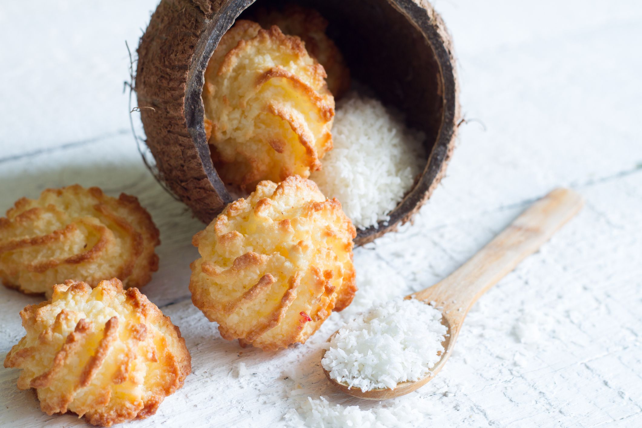 Coconut cookies macarons with copra on a white background closeup
