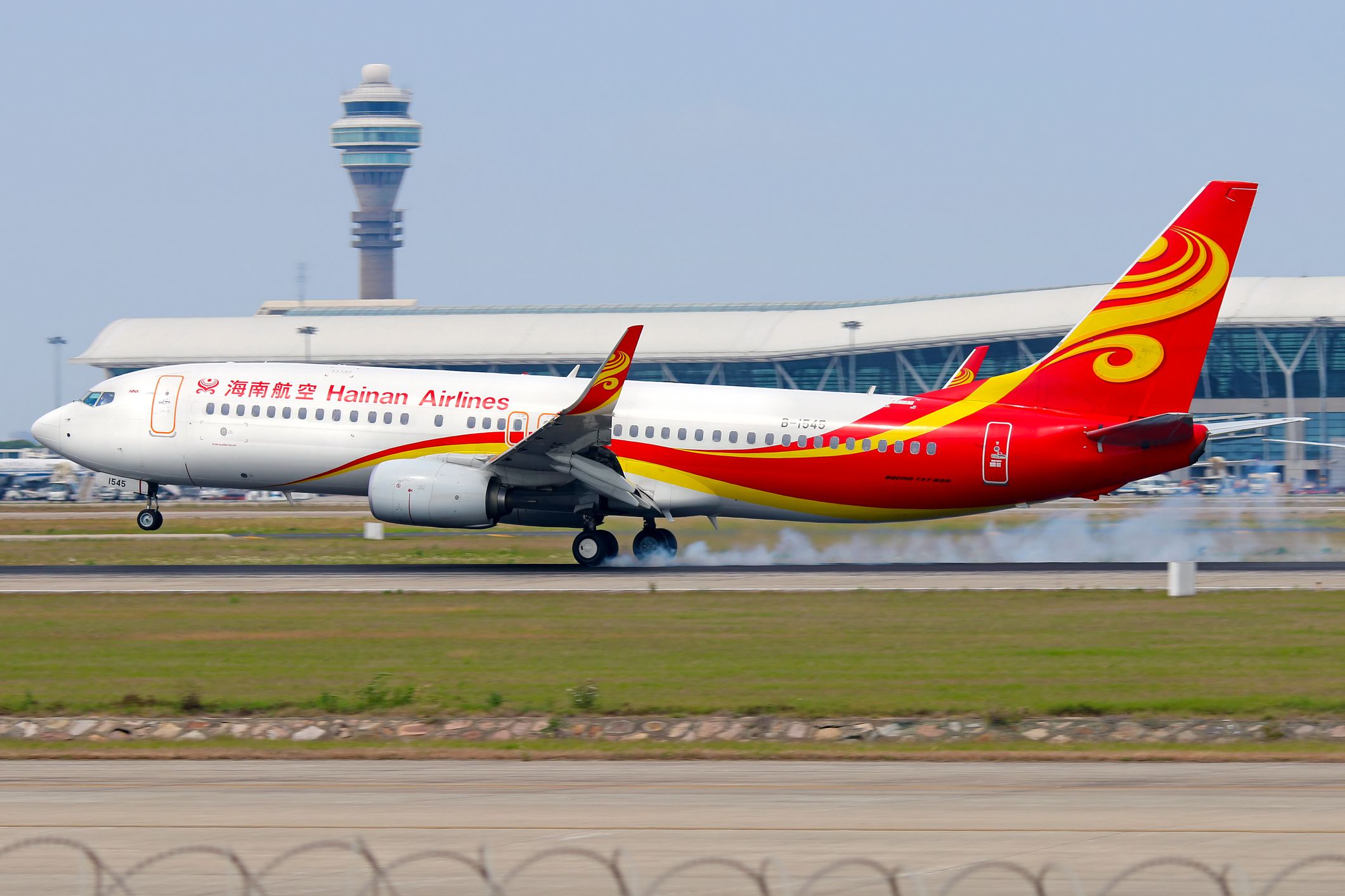 Shanghai, China - May 30, 2017: A Hainan Airlines Boeing 737 lands at Shanghai Pudong airport.