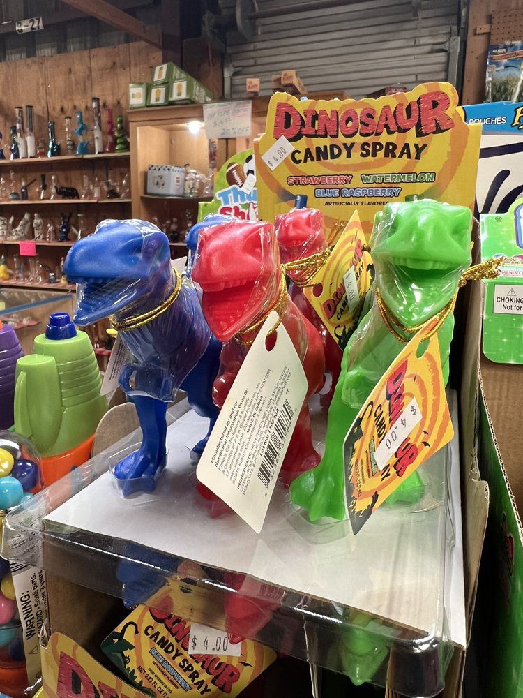three plastic dinosaurs