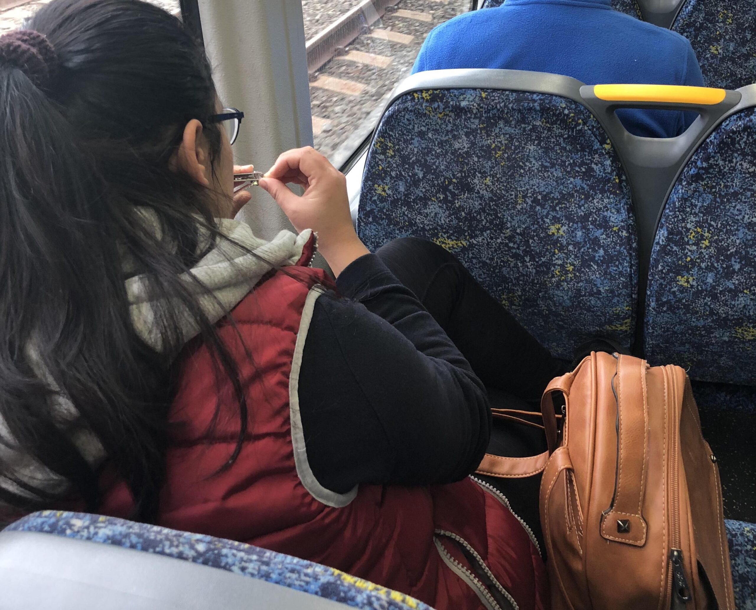Clipping Nails on Subway