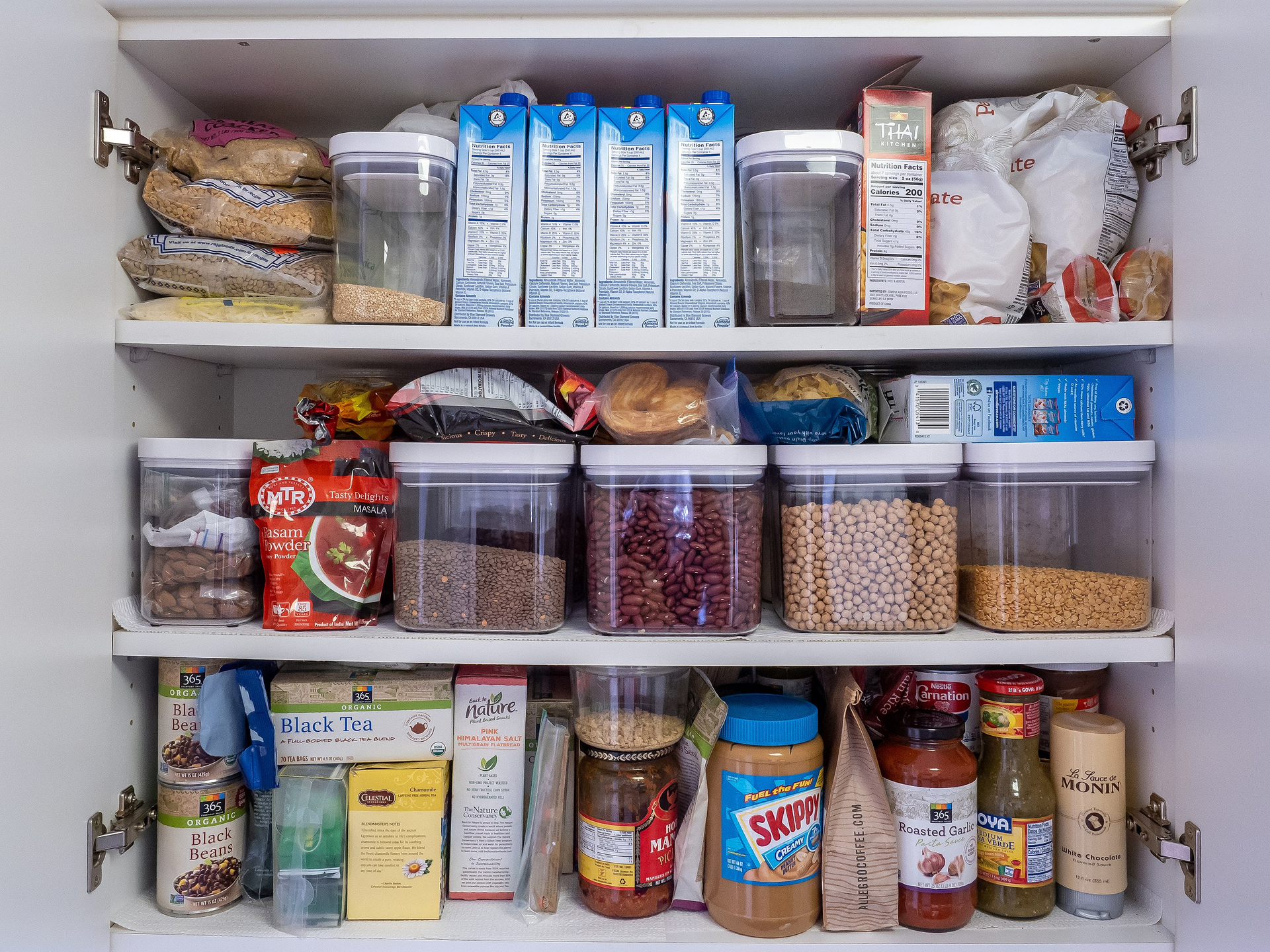 Fully Stocked Kitchen Pantry With Many Different Types of Dry Goods