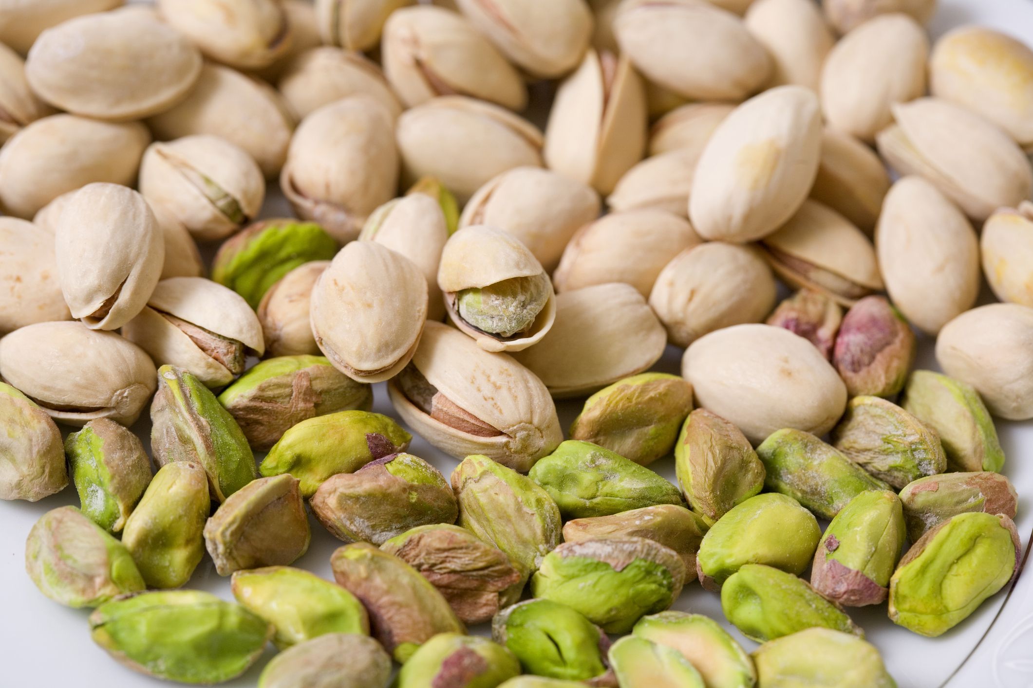 Shelled and unshelled roasted pistachios.