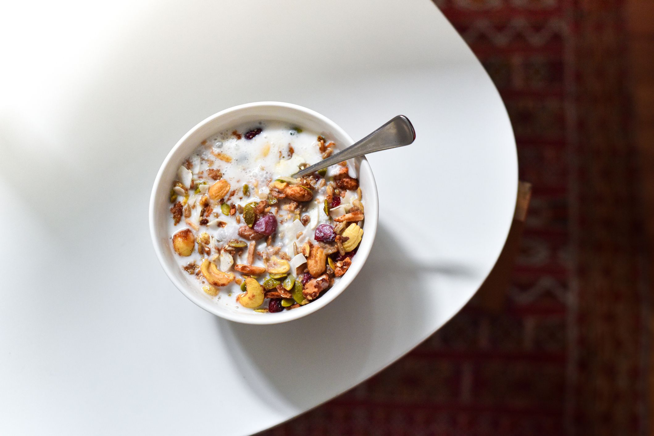 A bowl of mixed granola, nuts, seeds and dried fruit