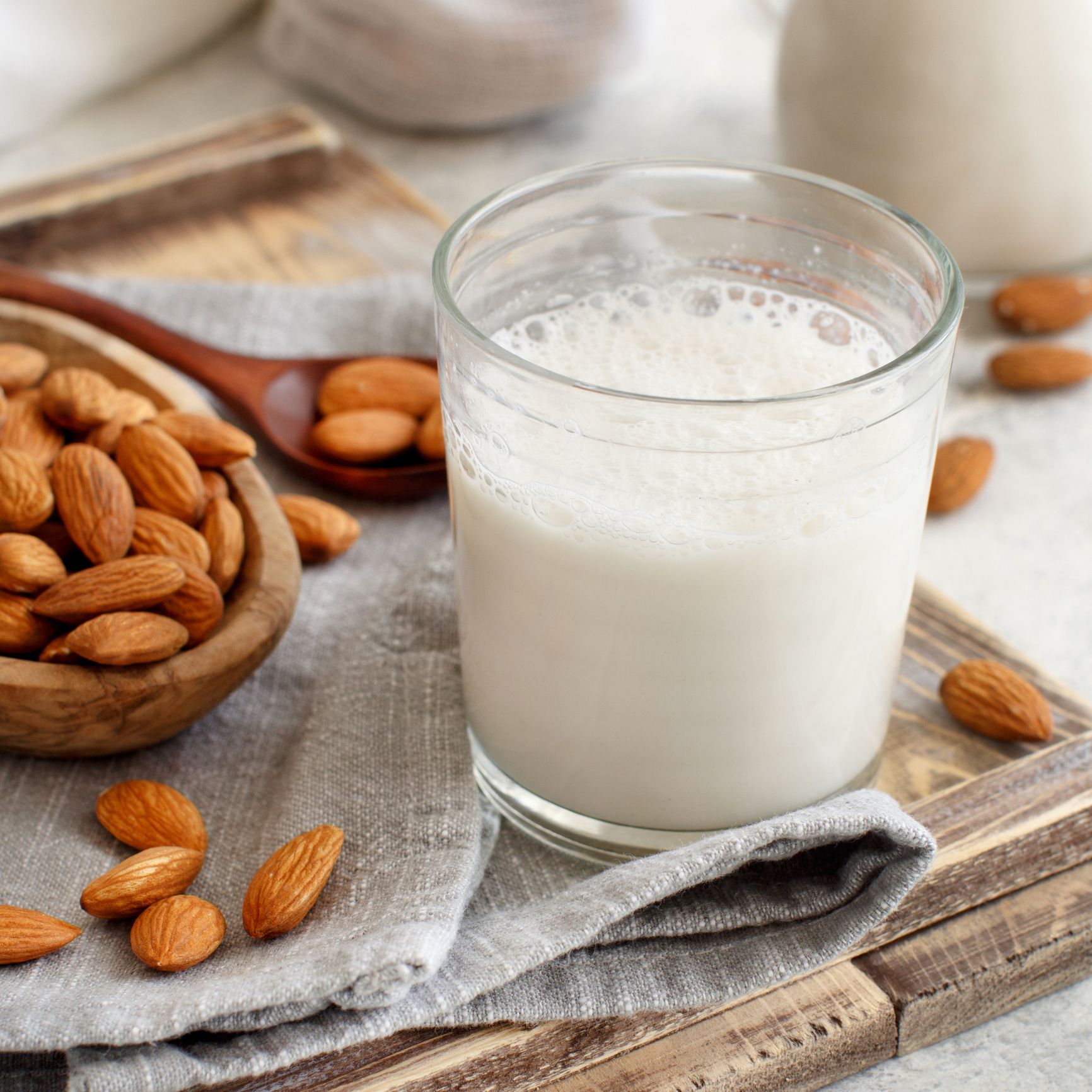 Vegan almond milk, non dairy alternative milk in a glass close up
