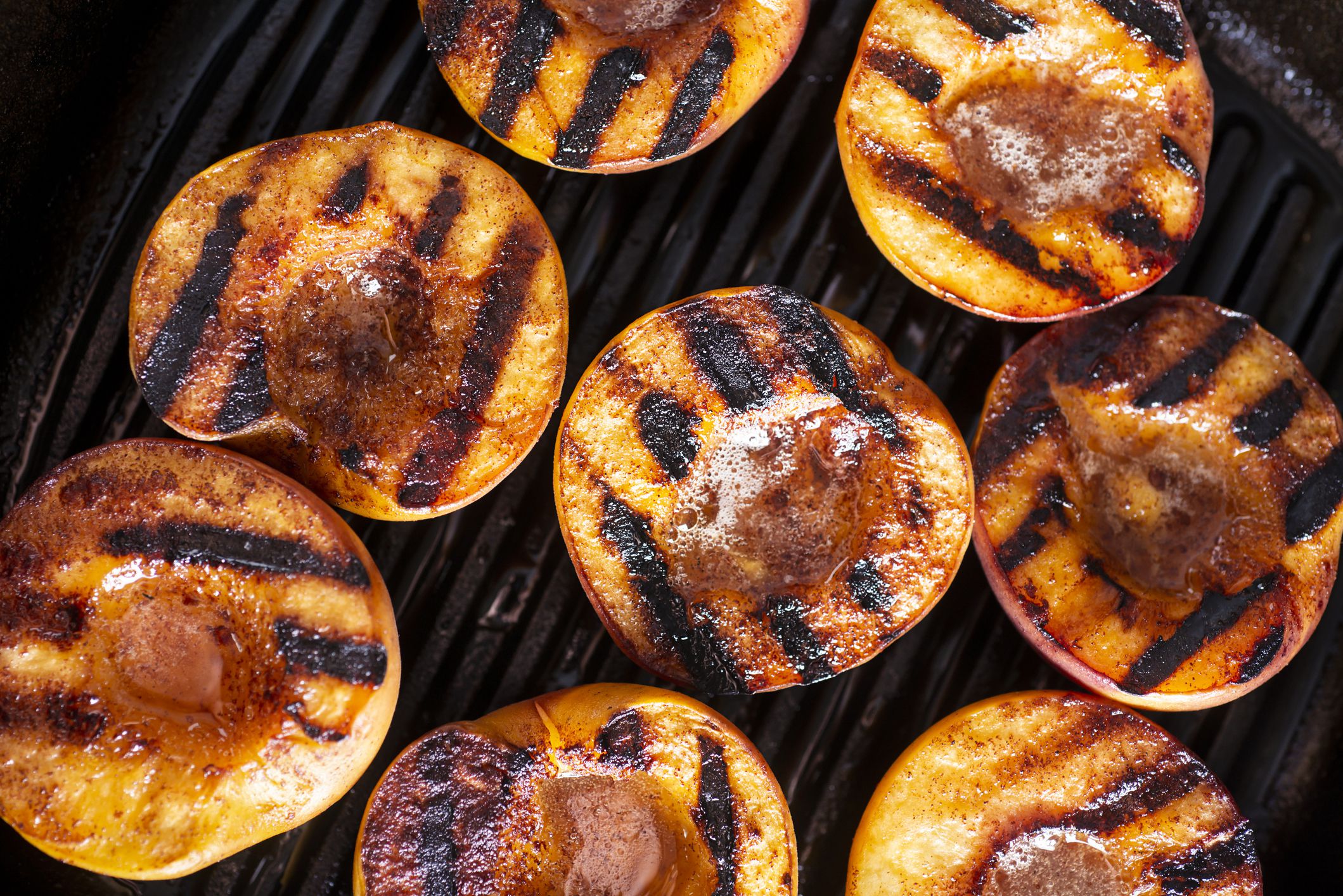 Close-up Image of Grilled Peaches in a Cast Iron Grill Pan