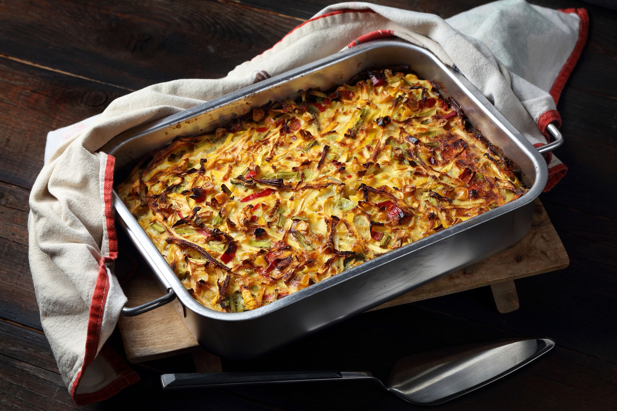 Homemade casserole with squash, asparagus, corn, chili pepper and garlic
