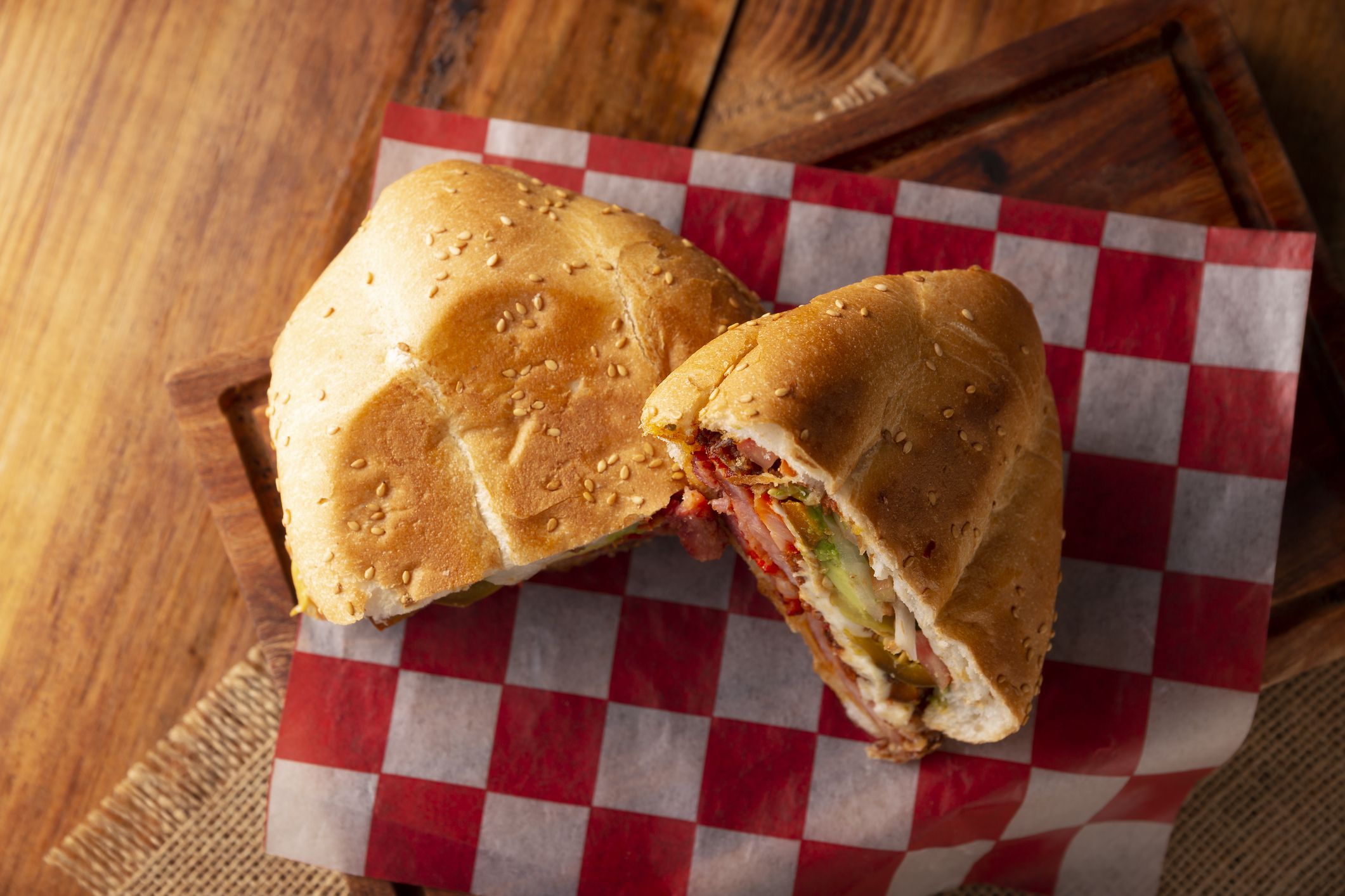Mexican Torta. Sandwich made with common bread in Mexico, it can be telera, bolillo or bagette, split in half and filled with various ingredients, in this case spicy pork leg with Oaxaca cheese.