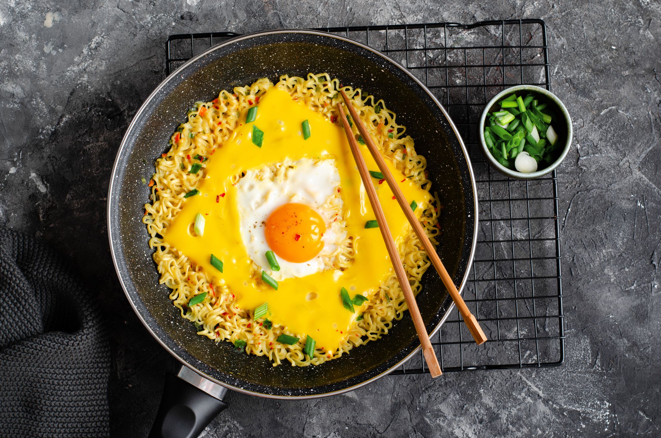 Kujirai Ramen, Shin Ramyeon or Ramyun with Egg, Melted Cheese and Scallion, Instant Noodles on Dark Background