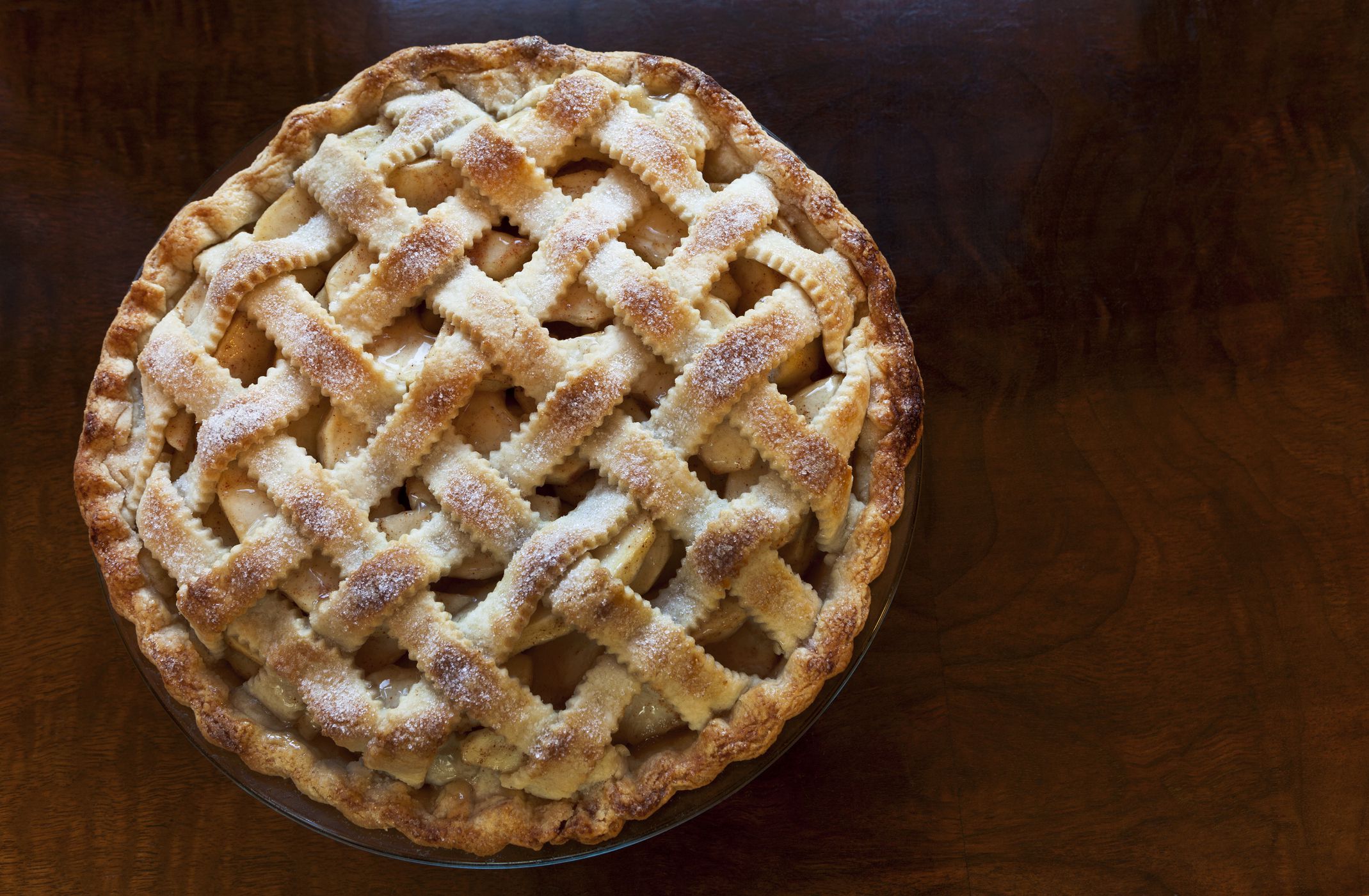 A overhead view of a lattice top apple pie.