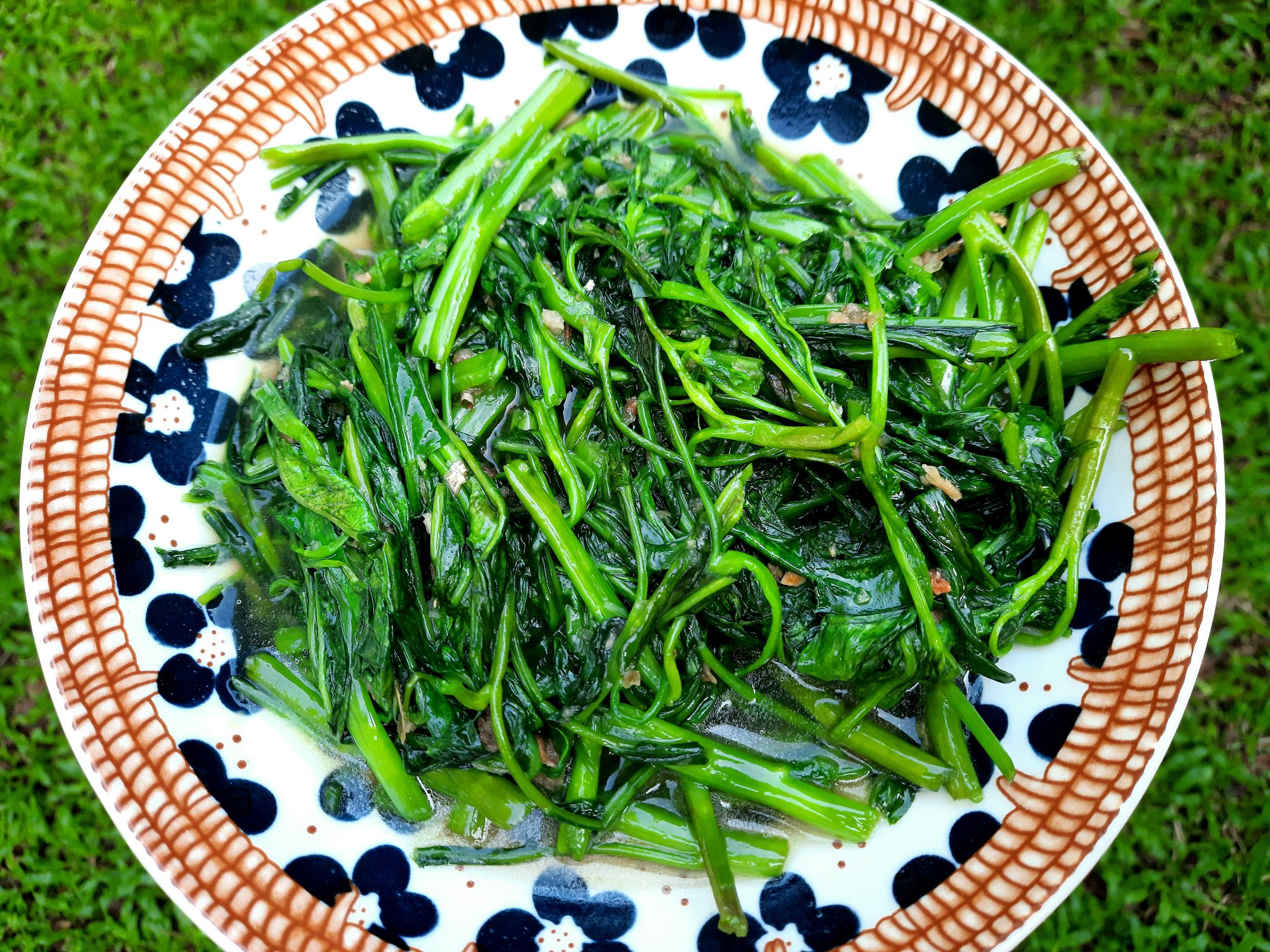 Cooking Stir fried Morning Glory vegetable - food preparation.