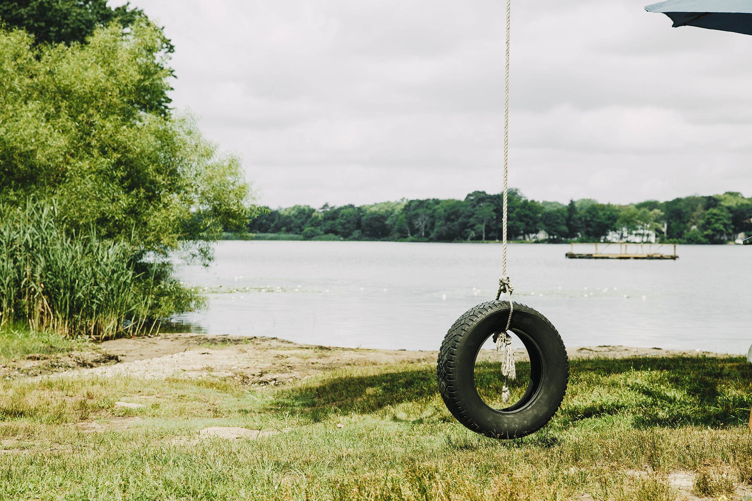 summer swing hanging near the river. retro style