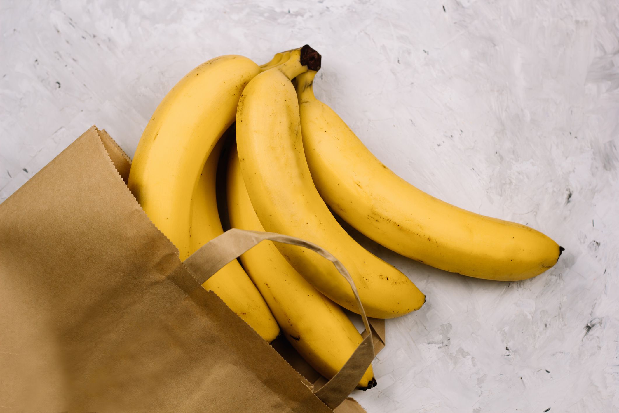 top view fresh bananas in paper bag