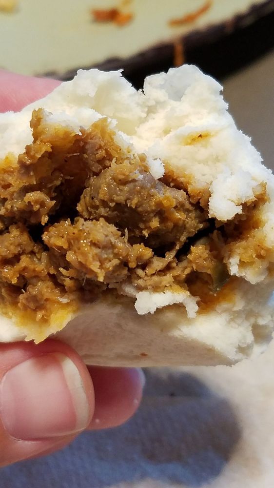 a bao with a bite out of it