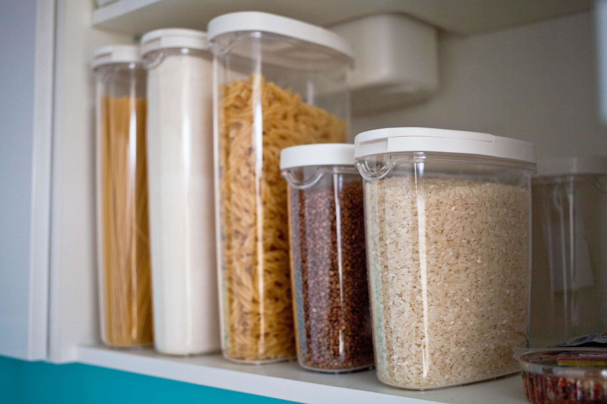Dry Goods in Organized Containers on a Pantry Shelf