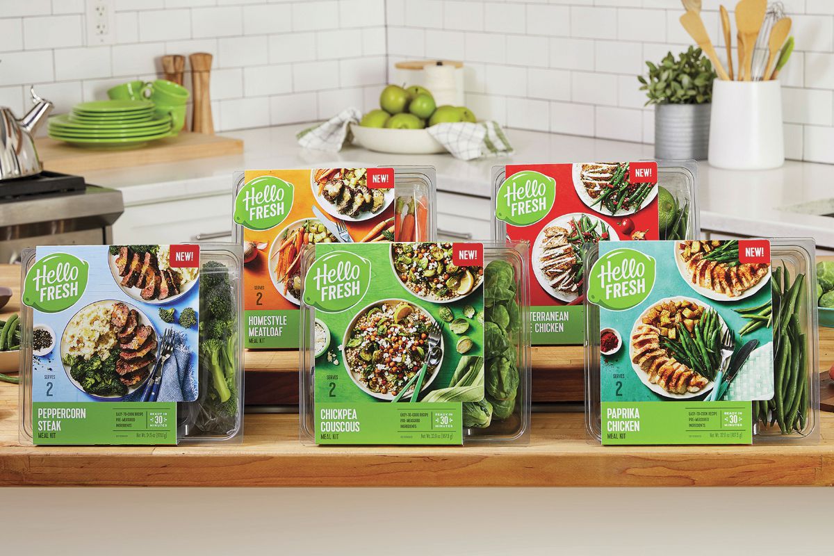 A selection of five different HelloFresh retail meal kits on an island in a kitchen, with countertop in the background